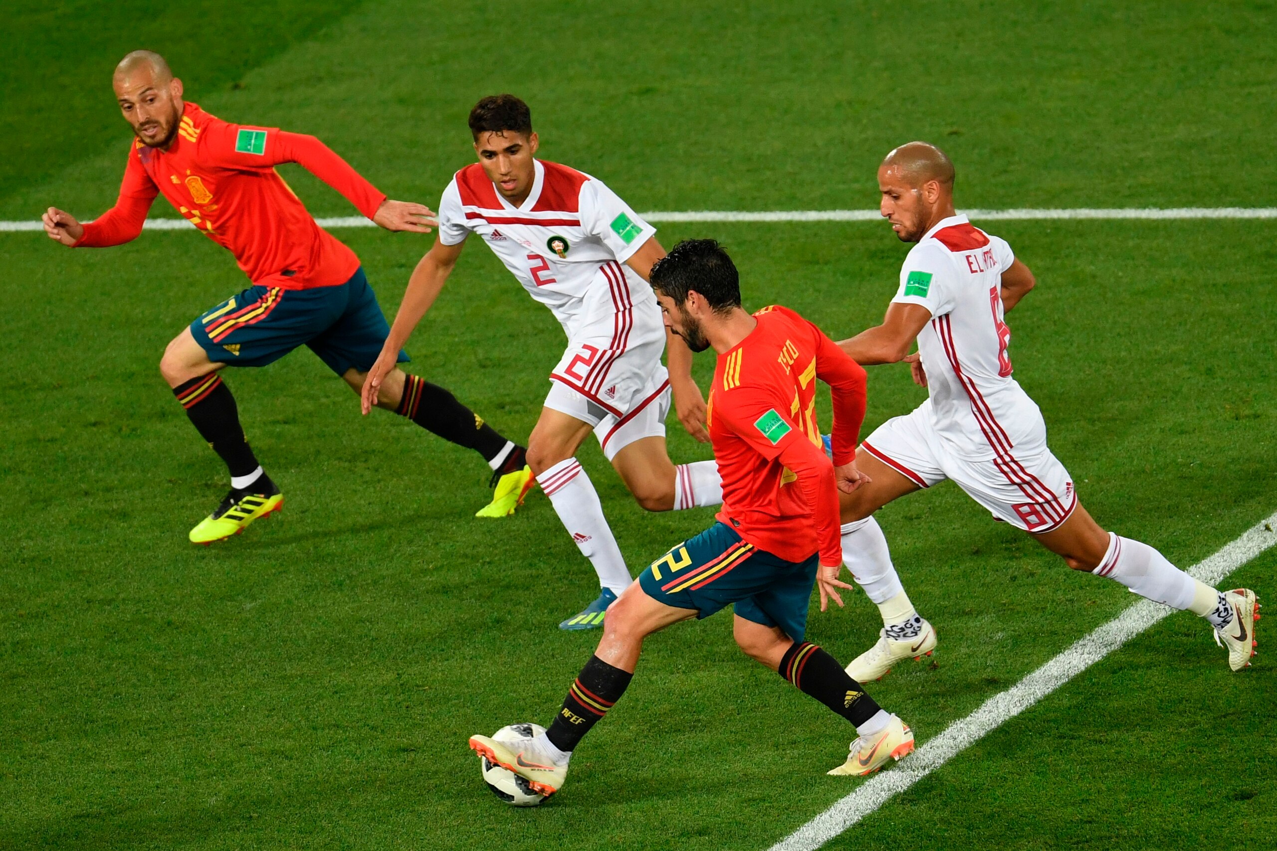 Spain's midfielder Isco (2dnR) controls the ball past (fromL) Spain's forward David Silva, Morocco's defender Achraf Hakimi and Morocco's midfielder Karim El Ahmadi during the Russia 2018 World Cup Group B football match between Spain and Morocco at the K Spain's midfielder Isco (2dnR) controls the ball past (fromL) Spain's forward David Silva, Morocco's defender Achraf Hakimi and Morocco's midfielder Karim El Ahmadi during the Russia 2018 World Cup Group B football match between Spain and Morocco at the K