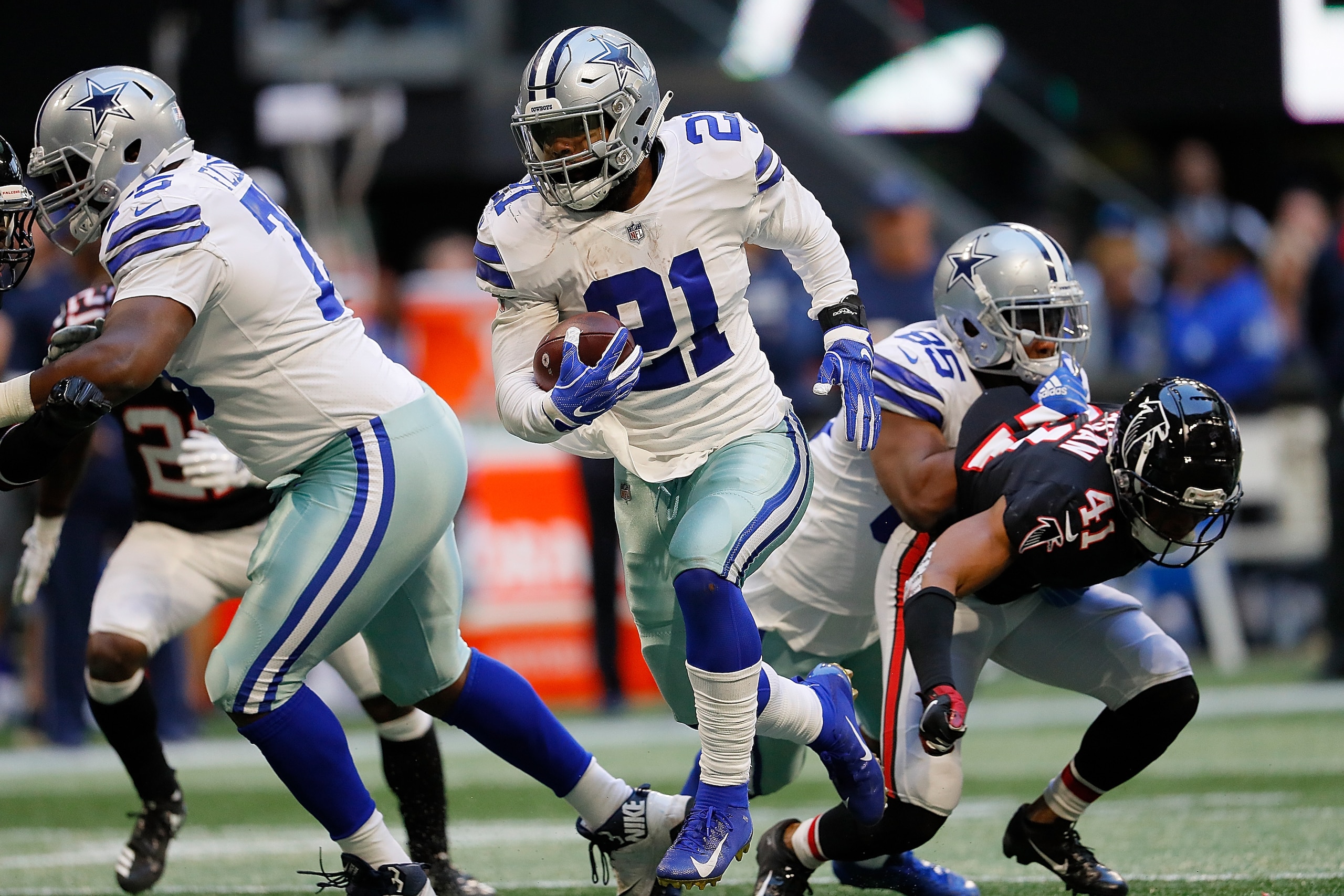ATLANTA, GA - NOVEMBER 18: Ezekiel Elliott #21 of the Dallas Cowboys rushes for a touchdown against the Atlanta Falcons at Mercedes-Benz Stadium on November 18, 2018 in Atlanta, Georgia. (Photo by Kevin C. Cox/Getty Images) ATLANTA, GA - NOVEMBER 18: Ezekiel Elliott #21 of the Dallas Cowboys rushes for a touchdown against the Atlanta Falcons at Mercedes-Benz Stadium on November 18, 2018 in Atlanta, Georgia. (Photo by Kevin C. Cox/Getty Images)