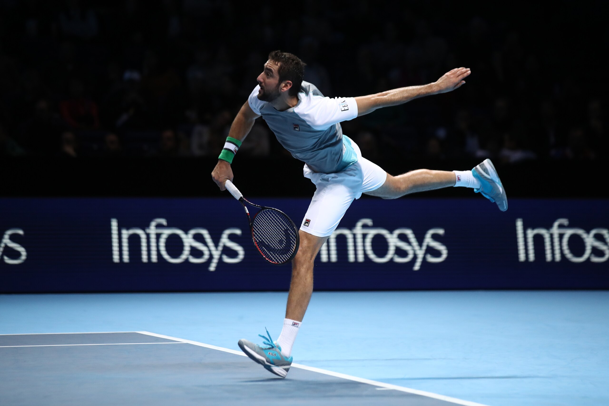 LONDON, ENGLAND - NOVEMBER 16:  Marin Cilic of Croatia in action in his third singles round robin match against Novak Djokovic of Serbia during Day Six of the Nitto ATP Finals at The O2 Arena on November 16, 2018 in London, England.  (Photo by Julian Finn