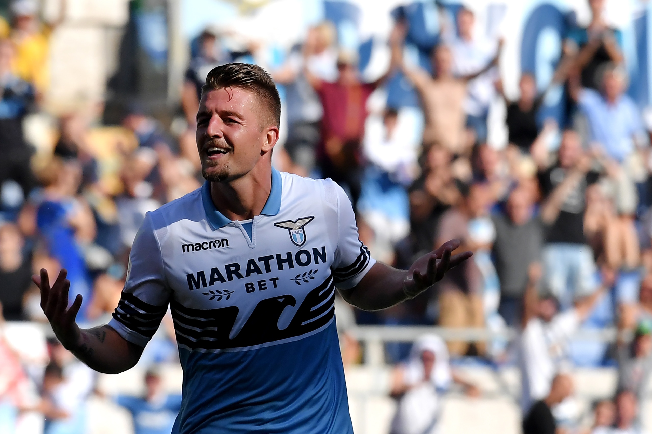 Lazio's Serbian midfielder Sergej Milinkovic-Savic   celebrates after scoring a goal  during the Italian Serie A football match between SS Lazio and Genoa CFC at the Olympic Stadium in Rome on September 23, 2018. (Photo by Tiziana FABI / AFP)        (Phot