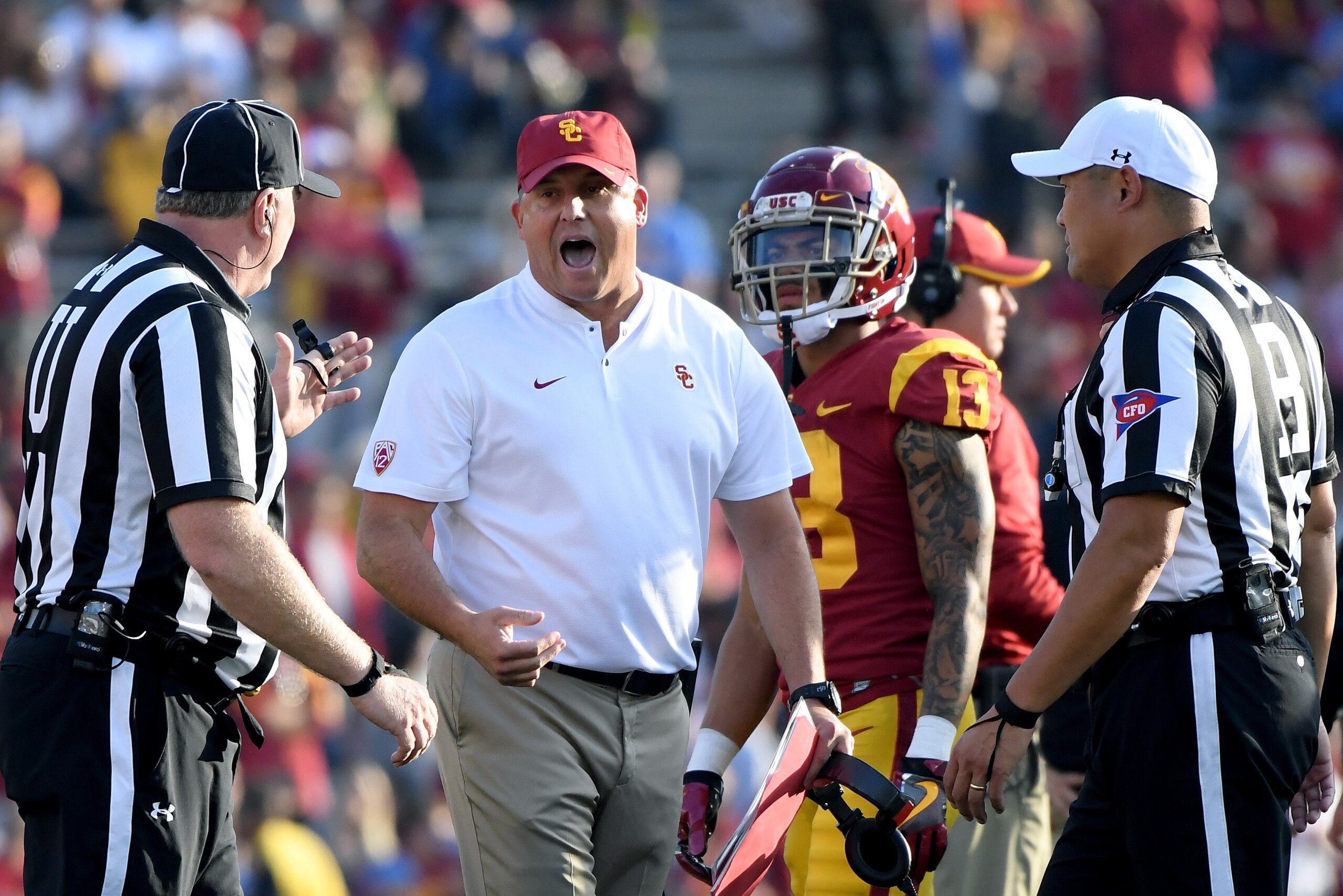 PASADENA, CALIFORNIA - NOVEMBER 17:   Head coach Clay Helton of the USC Trojans argues with the officials during a 34-27 loss to the UCLA Bruins at Rose Bowl on November 17, 2018 in Pasadena, California. (Photo by Harry How/Getty Images)