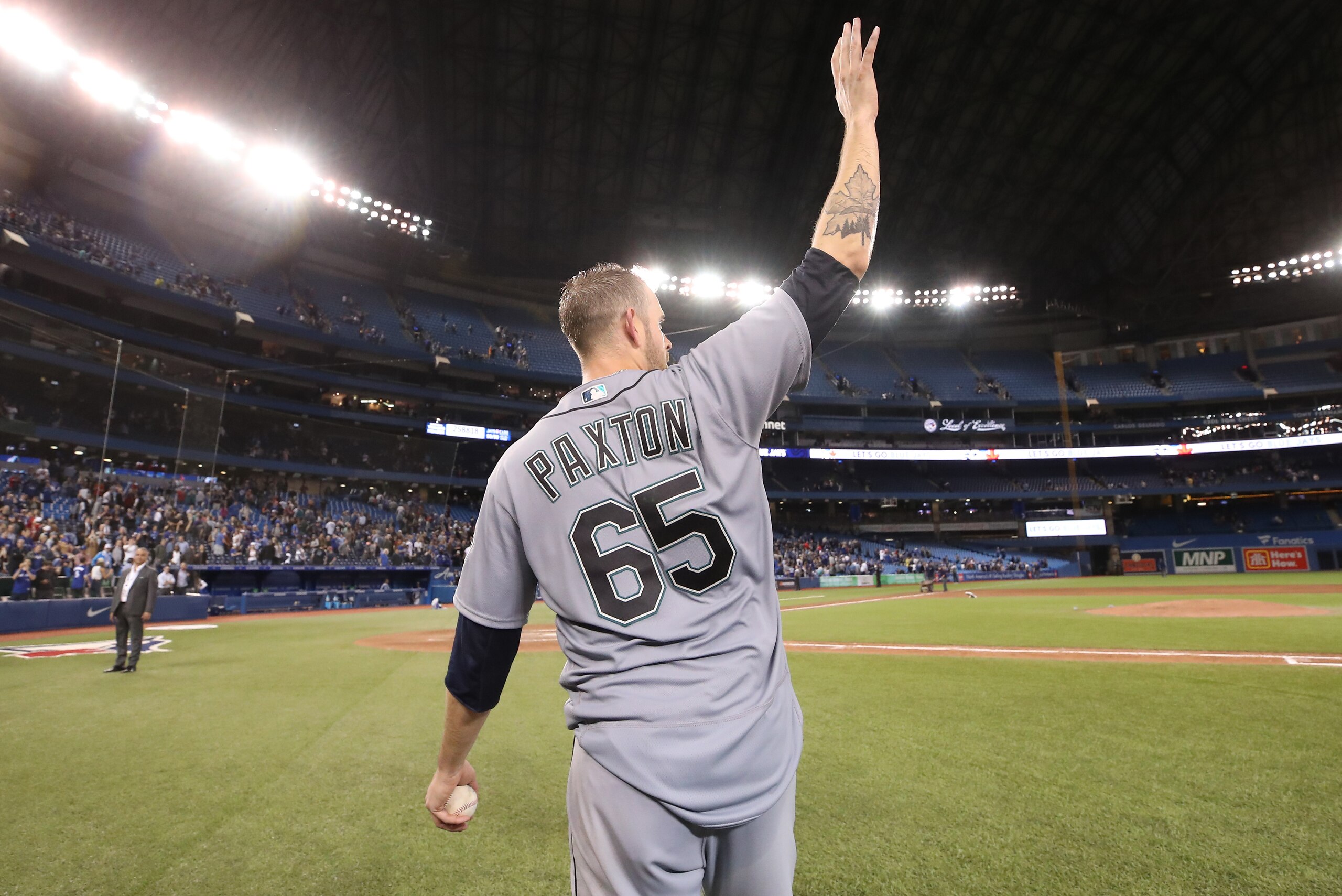 TORONTO, ON - MAY 8: James Paxton #65 of the Seattle Mariners acknowledges the crowd after throwing a no-hitter during MLB game action against the Toronto Blue Jays at Rogers Centre on May 8, 2018 in Toronto, Canada. (Photo by Tom Szczerbowski/Getty Image