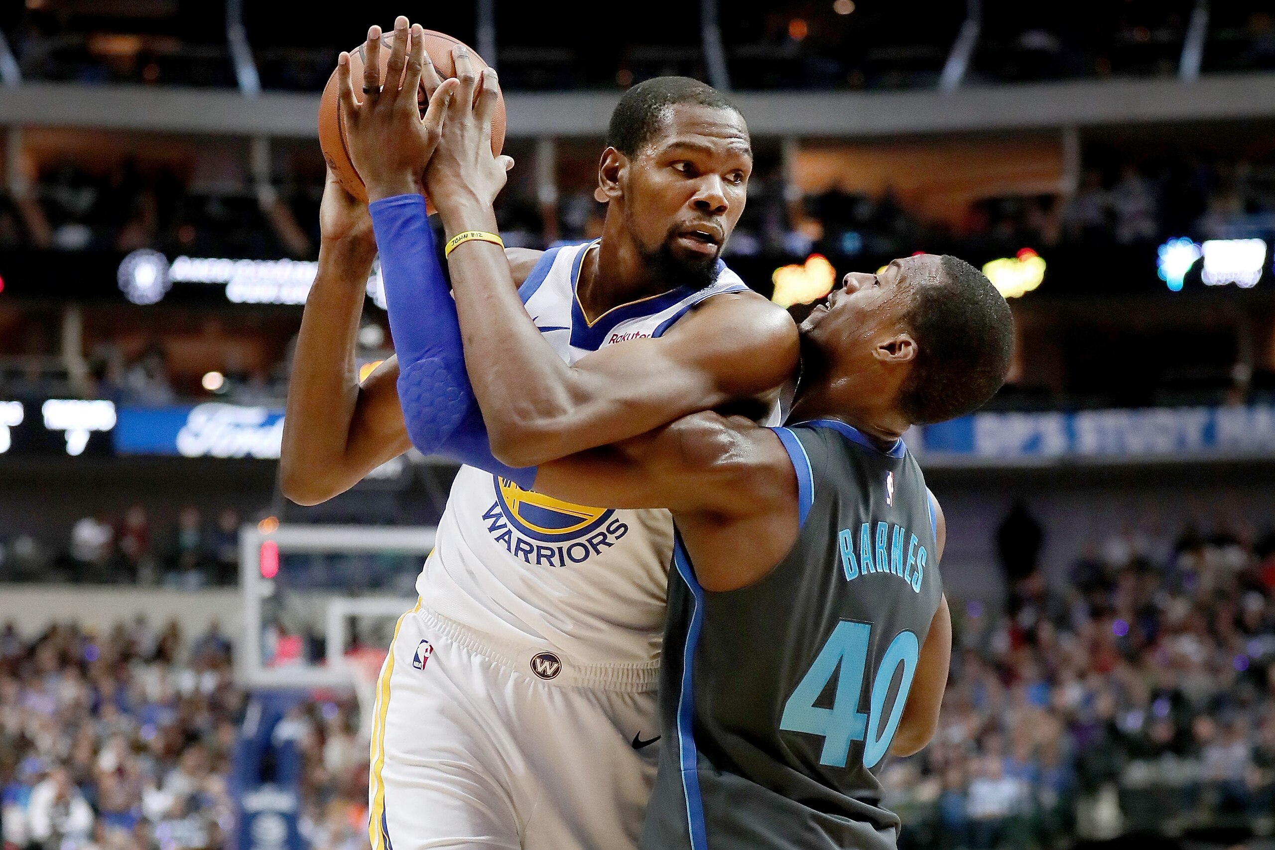 DALLAS, TX - NOVEMBER 17:  Kevin Durant #35 of the Golden State Warriors controls the ball against Harrison Barnes #40 of the Dallas Mavericks in the first half at American Airlines Center on November 17, 2018 in Dallas, Texas. NOTE TO USER: User expressl