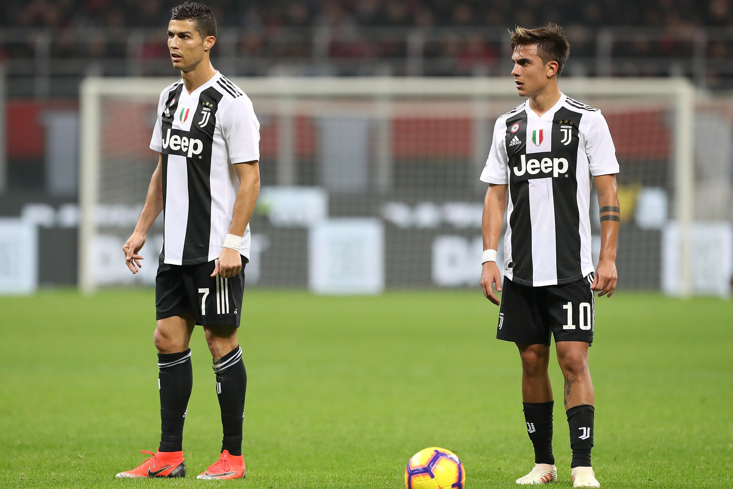 MILAN, ITALY - NOVEMBER 11:  Cristiano Ronaldo and Paulo Dybala of Juventus FC look on during the Serie A match between AC Milan and Juventus at Stadio Giuseppe Meazza on November 11, 2018 in Milan, Italy.  (Photo by Marco Luzzani/Getty Images)