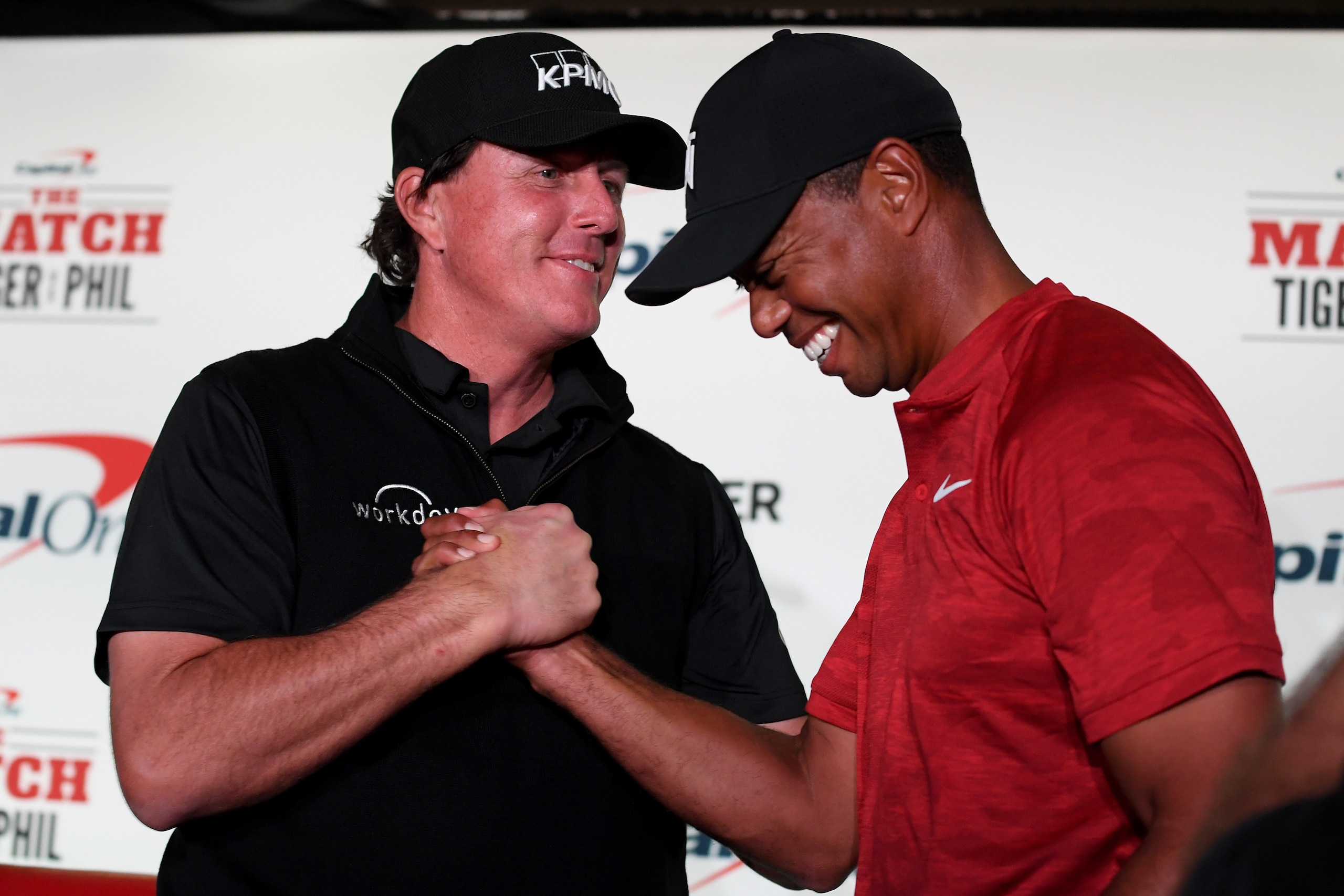 LAS VEGAS, NV - NOVEMBER 20:  (L-R) Phil Mickelson and Tiger Woods shake hands during a press conference before The Match at Shadow Creek Golf Course on November 20, 2018 in Las Vegas, Nevada.  (Photo by Harry How/Getty Images for The Match)
