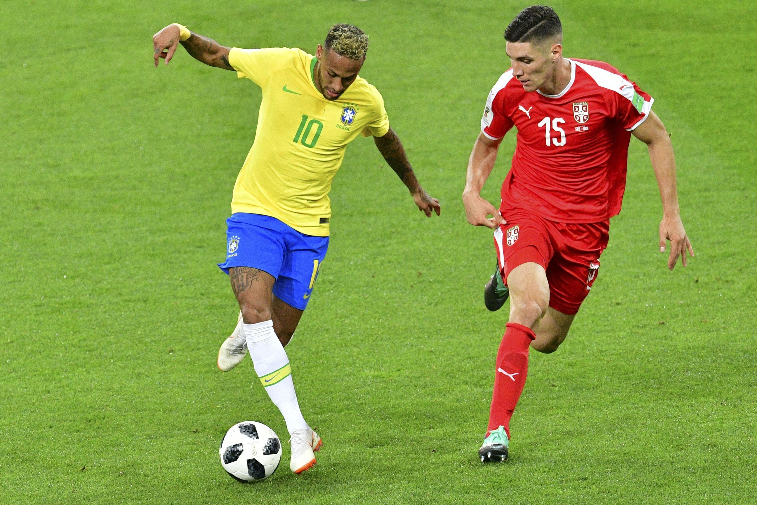 Brazil's forward Neymar (L) challenges Serbia's defender Nikola Milenkovic during the Russia 2018 World Cup Group E football match between Serbia and Brazil at the Spartak Stadium in Moscow on June 27, 2018. (Photo by Mladen ANTONOV / AFP) / RESTRICTED TO Brazil's forward Neymar (L) challenges Serbia's defender Nikola Milenkovic during the Russia 2018 World Cup Group E football match between Serbia and Brazil at the Spartak Stadium in Moscow on June 27, 2018. (Photo by Mladen ANTONOV / AFP) / RESTRICTED TO