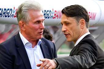 Frankfurt's Croatian head coach Niko Kovac (R) and Bayern Munich's German head coach Jupp Heynckes talk ahead the German Cup DFB Pokal final football match FC Bayern Munich vs Eintracht Frankfurt at the Olympic Stadium in Berlin on May 19, 2018. (Photo by