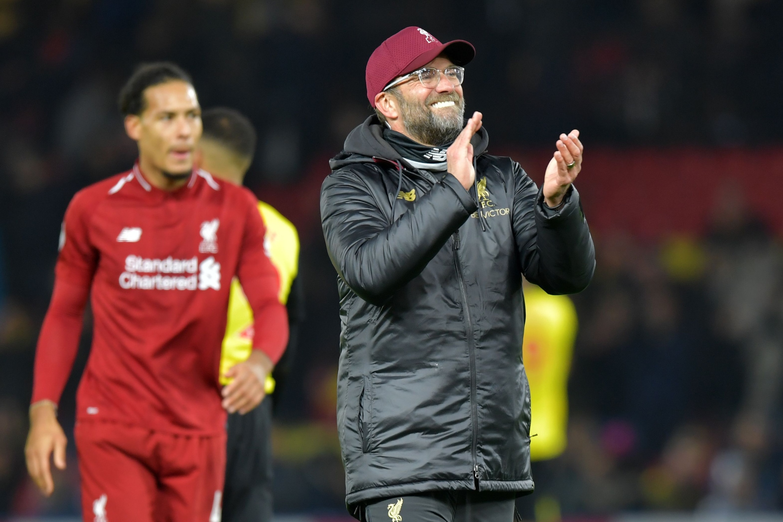 Liverpool's German manager Jurgen Klopp celebrates on the pitch after the English Premier League football match between Watford and Liverpool at Vicarage Road Stadium in Watford, north of London on November 24, 2018. - Liverpool won the game 3-0. (Photo b