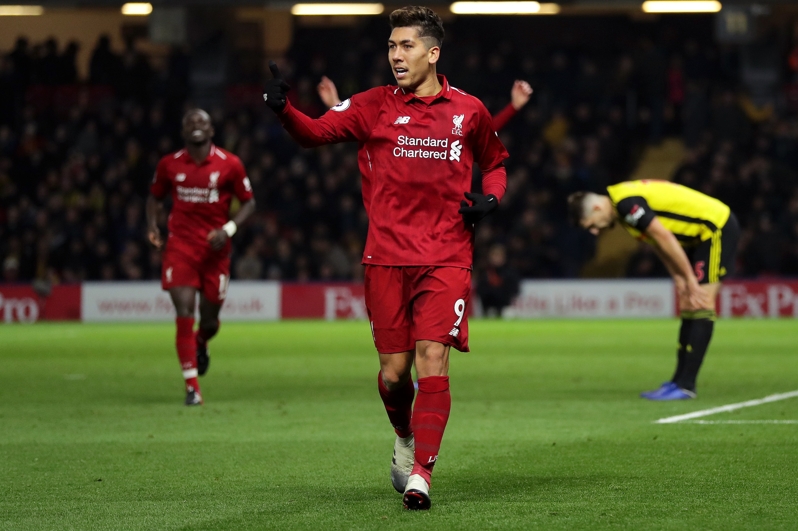 WATFORD, ENGLAND - NOVEMBER 24:  Roberto Firmino of Liverpool celebrates after scoring his team's third goal during the Premier League match between Watford FC and Liverpool FC at Vicarage Road on November 24, 2018 in Watford, United Kingdom.  (Photo by R