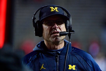 PISCATAWAY, NJ - NOVEMBER 10: Head coach Jim Harbaugh of the Michigan Wolverines coaches against the Rutgers Scarlet Knights during the third quarter at HighPoint.com Stadium on November 10, 2018 in Piscataway, New Jersey. Michigan won 42-7. (Photo by Cor