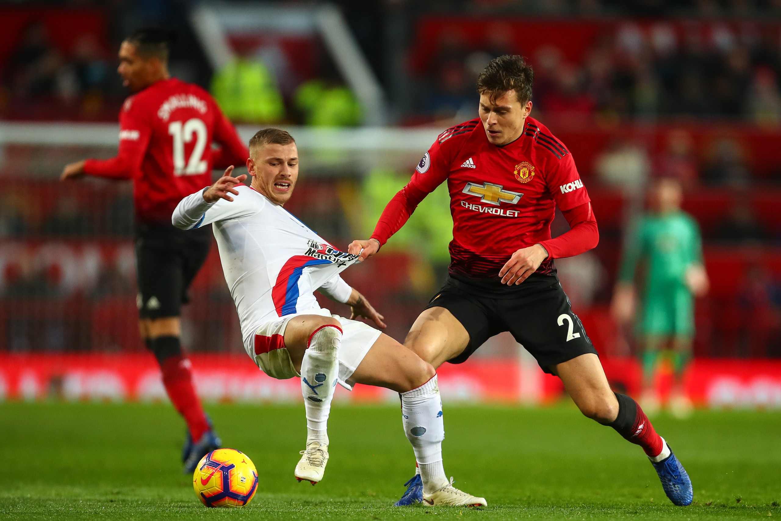 MANCHESTER, ENGLAND - NOVEMBER 24: Max Meyer of Crystal Palace and Victor Lindelof of Manchester United during the Premier League match between Manchester United and Crystal Palace at Old Trafford on November 24, 2018 in Manchester, United Kingdom. (Photo