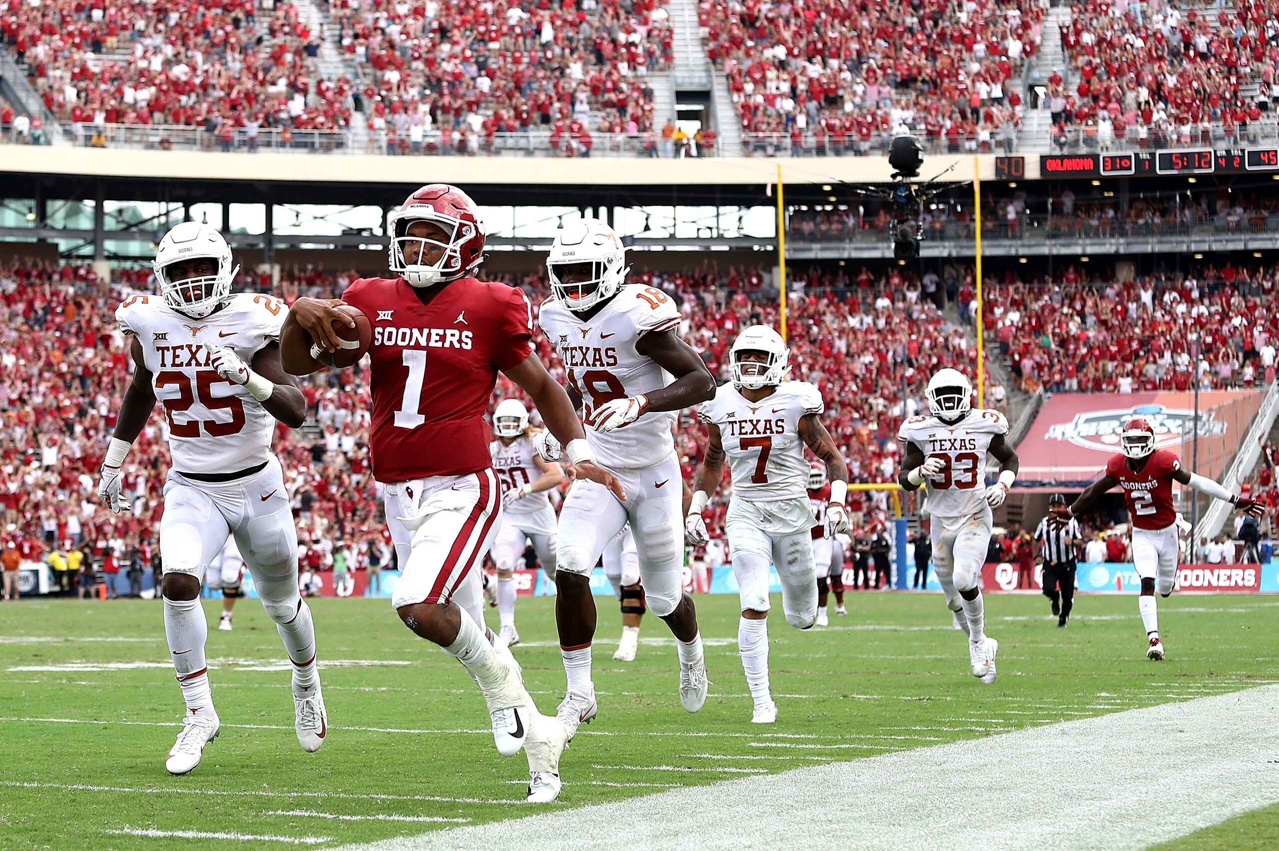 DALLAS, TX - OCTOBER 06:  Kyler Murray #1 of the Oklahoma Sooners runs for a touchdown against the Texas Longhorns in the fourth quarter of the 2018 AT&T Red River Showdown at Cotton Bowl on October 6, 2018 in Dallas, Texas.  (Photo by Ronald Martinez/Get