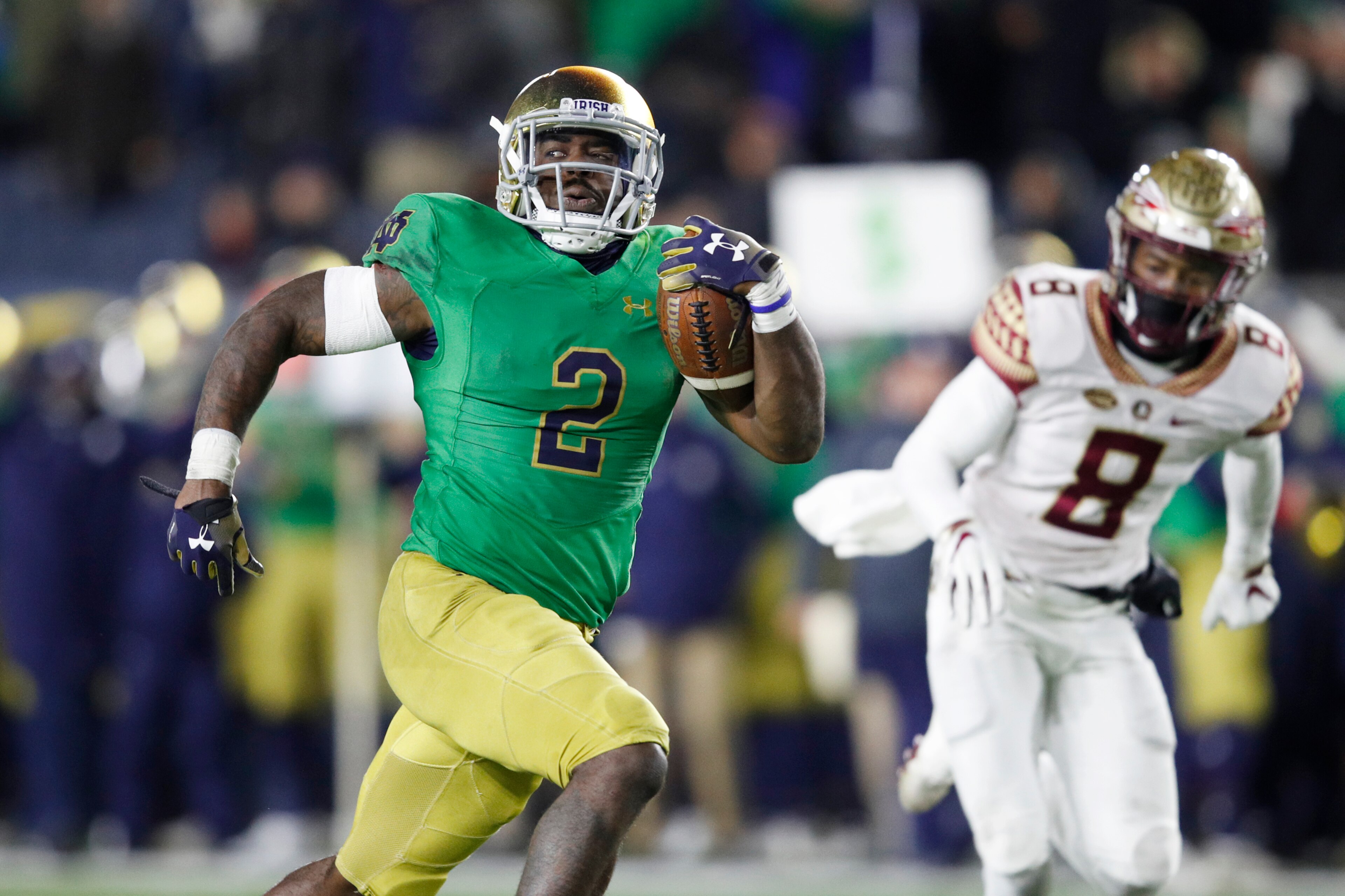 SOUTH BEND, IN - NOVEMBER 10: Dexter Williams #2 of the Notre Dame Fighting Irish runs the ball for a 32-yard touchdown during the game against the Florida State Seminoles at Notre Dame Stadium on November 10, 2018 in South Bend, Indiana. Notre Dame won 4