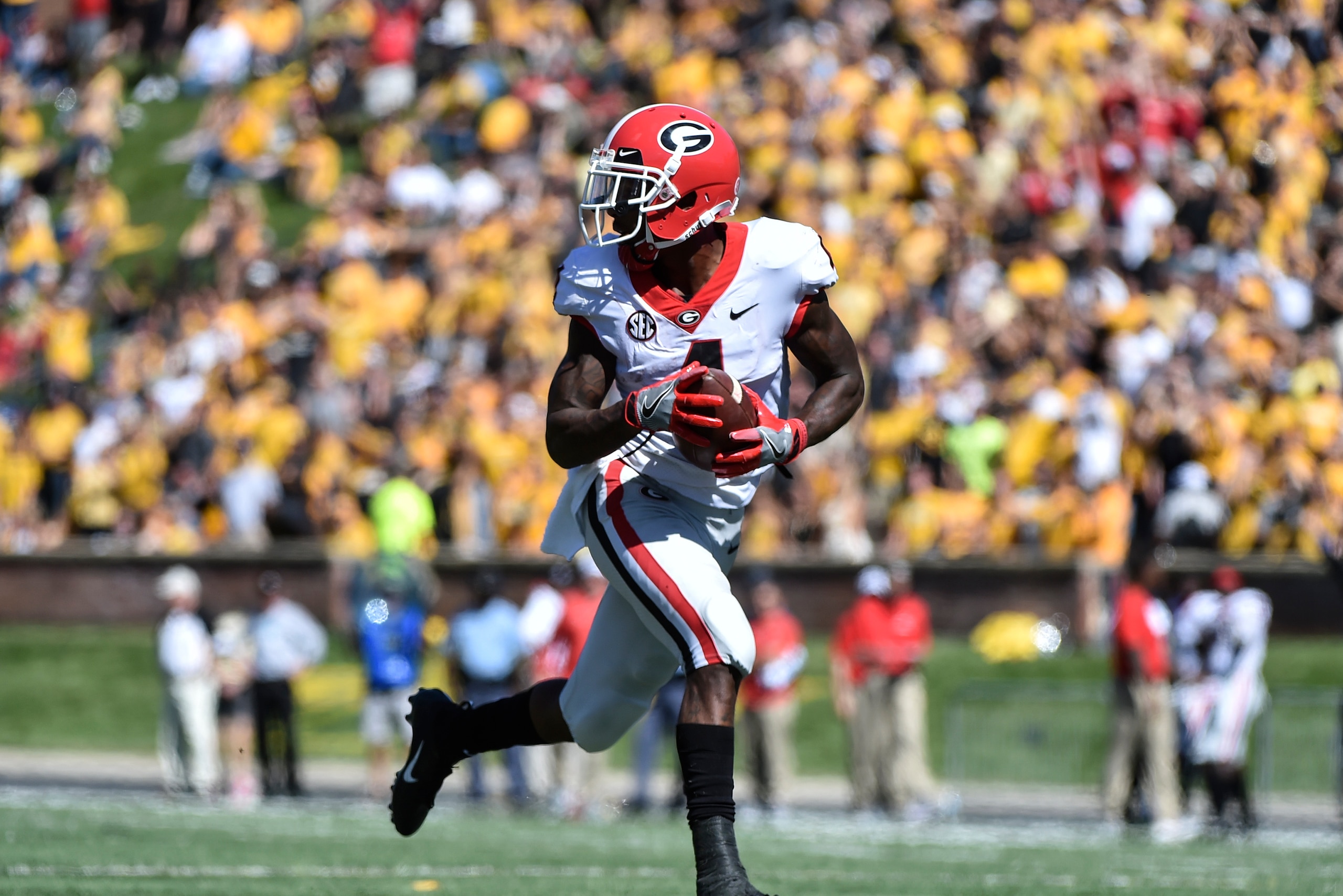 COLUMBIA, MO - SEPTEMBER 22: Wide receiver Mecole Hardman #4 of the Georgia Bulldogs runs for a touchdown pass against the Missouri Tigers in the fourth quarter at Memorial Stadium on September 22, 2018 in Columbia, Missouri. (Photo by Ed Zurga/Getty Imag COLUMBIA, MO - SEPTEMBER 22: Wide receiver Mecole Hardman #4 of the Georgia Bulldogs runs for a touchdown pass against the Missouri Tigers in the fourth quarter at Memorial Stadium on September 22, 2018 in Columbia, Missouri. (Photo by Ed Zurga/Getty Imag