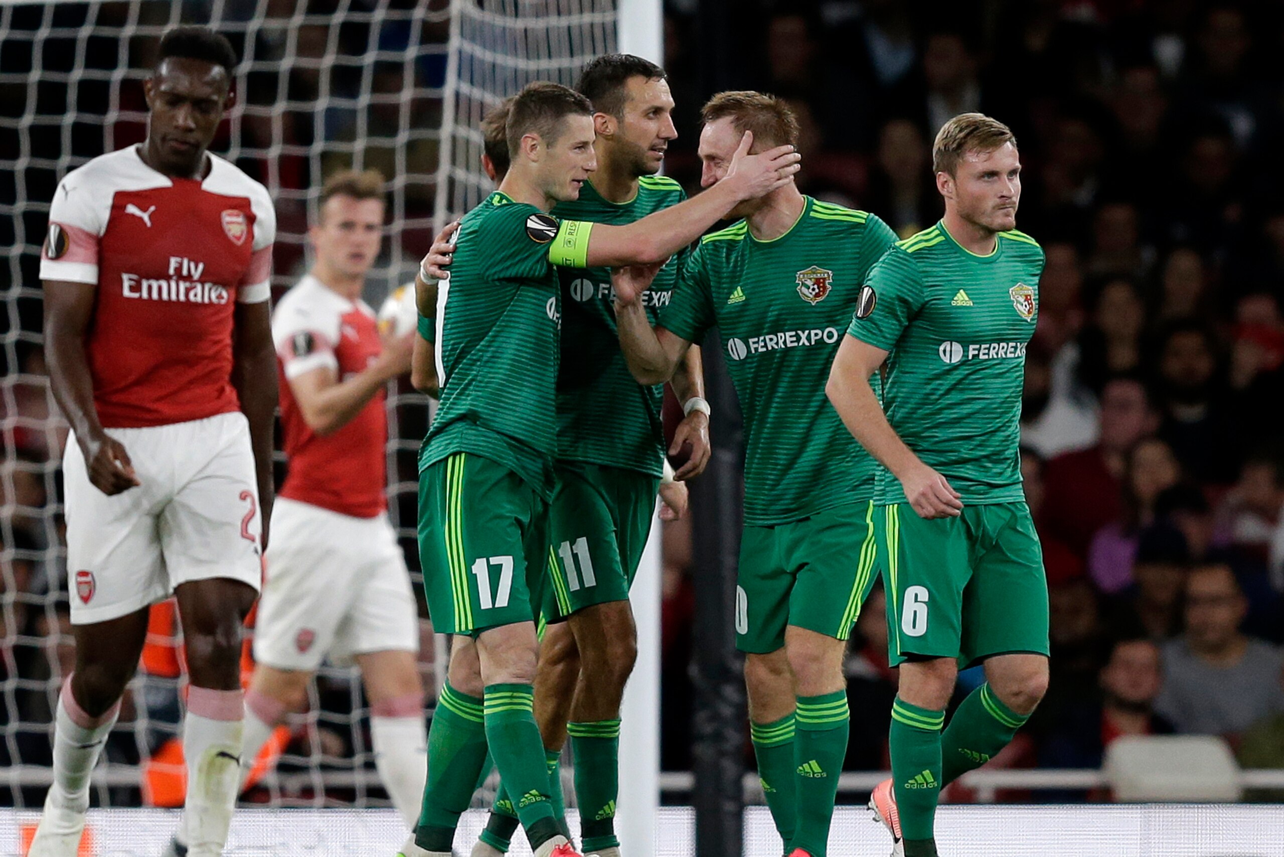 LONDON, ENGLAND - SEPTEMBER 20: Volodymyr Chesnakov of Vorskla Poltava celebrates after scoring his team's first goal with his team mates during the UEFA Europa League Group E match between Arsenal and Vorskla Poltava at Emirates Stadium on September 20, 