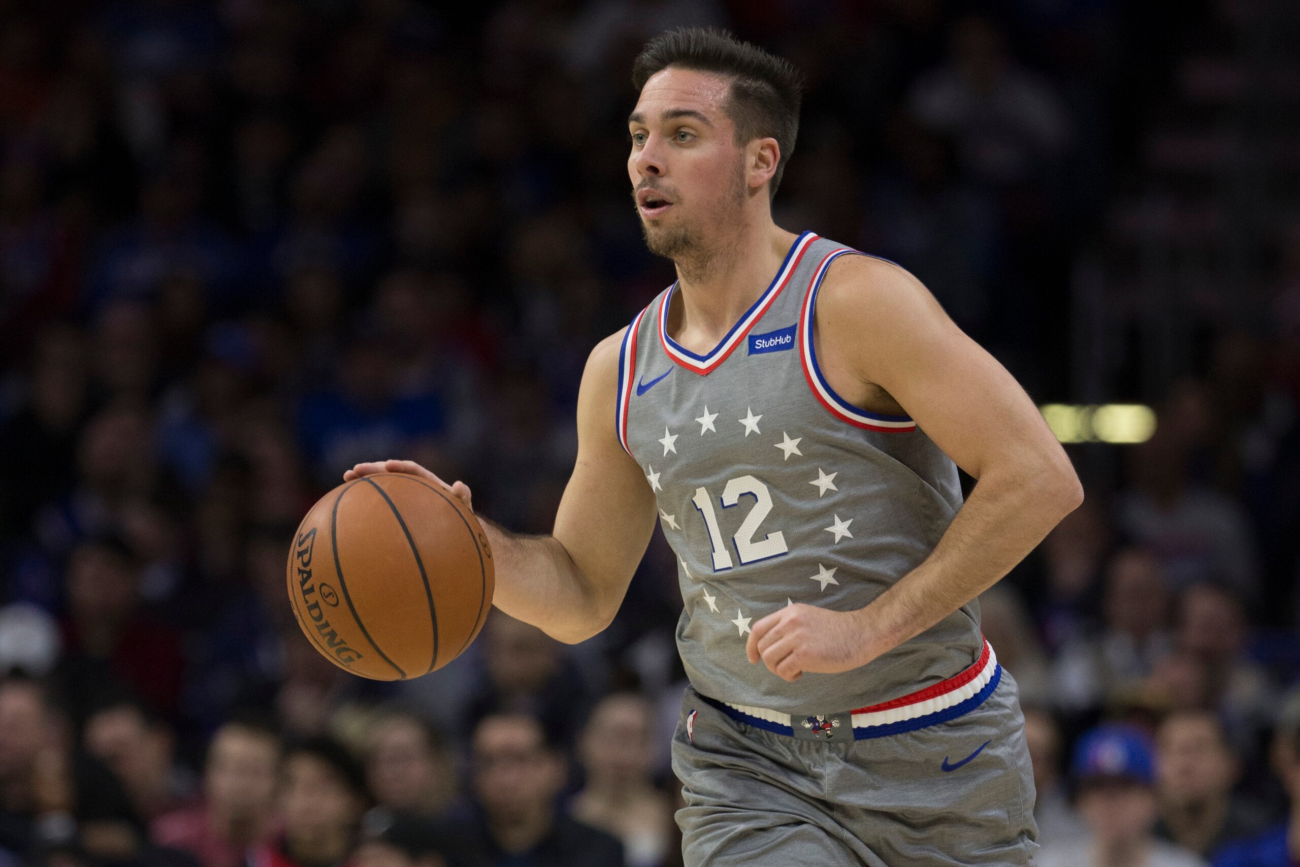 PHILADELPHIA, PA - NOVEMBER 23: T.J. McConnell #12 of the Philadelphia 76ers dribbles the ball against the Cleveland Cavaliers at the Wells Fargo Center on November 23, 2018 in Philadelphia, Pennsylvania. NOTE TO USER: User expressly acknowledges and agre