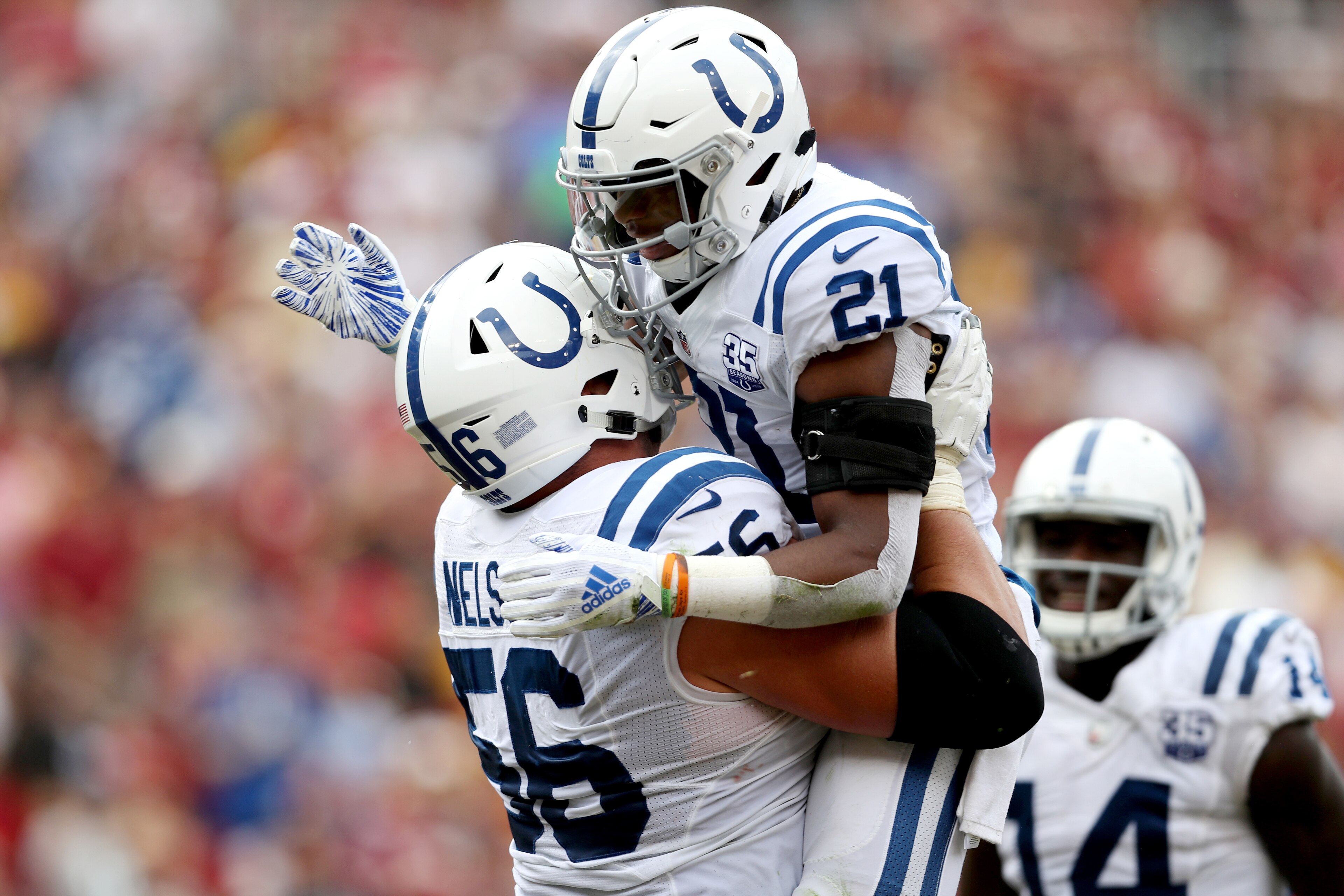 LANDOVER, MD - SEPTEMBER 16: Nyheim Hines #21 of the Indianapolis Colts celebrates scoring a first half touchdown with teammate Quenton Nelson #56 against the Washington Redskins for a first half touchdown at FedExField on September 16, 2018 in Landover, 