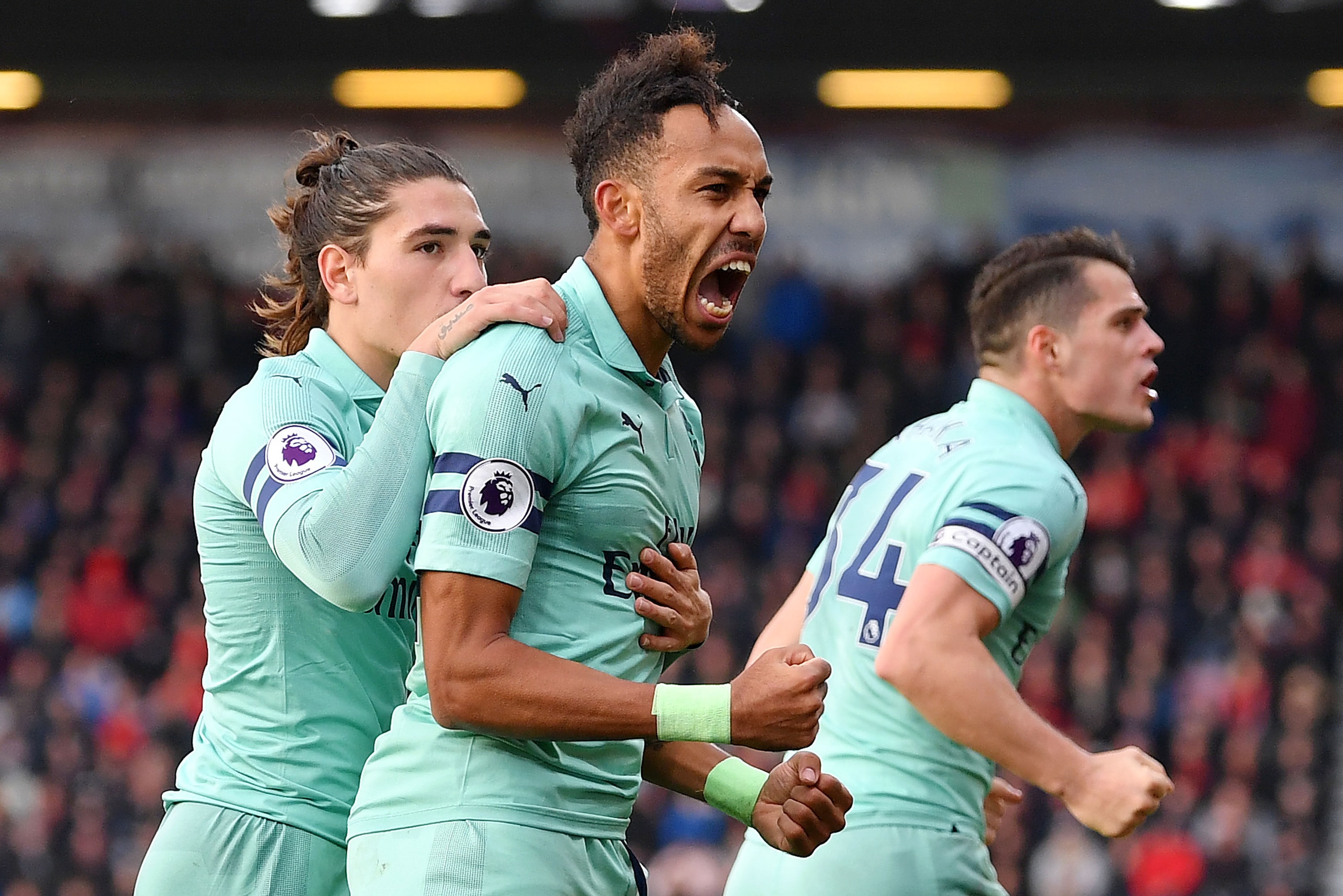 BOURNEMOUTH, ENGLAND - NOVEMBER 25:  Pierre-Emerick Aubameyang of Arsenal celebrates after scoring his team's second goal with Hector Bellerin during the Premier League match between AFC Bournemouth and Arsenal FC at Vitality Stadium on November 25, 2018 
