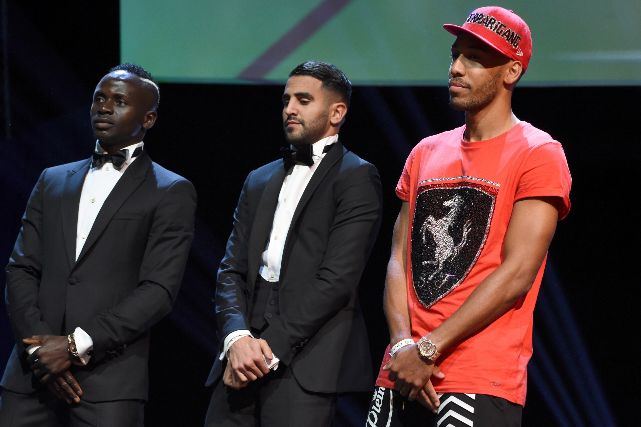 African best players from left, Senegalese Sadio Mane, Algerian Riyad Mahrez, and Gabonese Pierre-Emerick Aubameyang stands for the announcement of African Footballer of the Year in Abuja, on January 5, 2017. 
Algerian and Leicester striker Riyad Mahrez h