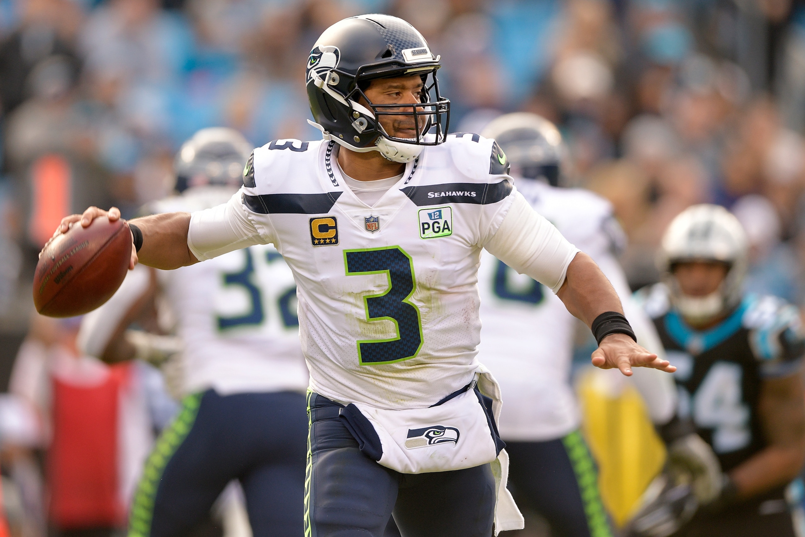 CHARLOTTE, NC - NOVEMBER 25: Russell Wilson #3 of the Seattle Seahawks rolls out against the Carolina Panthers during the first half of their game at Bank of America Stadium on November 25, 2018 in Charlotte, North Carolina. (Photo by Grant Halverson/Ge CHARLOTTE, NC - NOVEMBER 25: Russell Wilson #3 of the Seattle Seahawks rolls out against the Carolina Panthers during the first half of their game at Bank of America Stadium on November 25, 2018 in Charlotte, North Carolina. (Photo by Grant Halverson/Ge