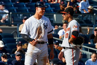 NEW YORK, NY - SEPTEMBER 17:  Aaron Judge #99 of the New York Yankees and Manny Machado #13 of the Baltimore Orioles talk at third base during a game at Yankee Stadium on September 17, 2017 in the Bronx borough of New York City. The Orioles defeated the Y