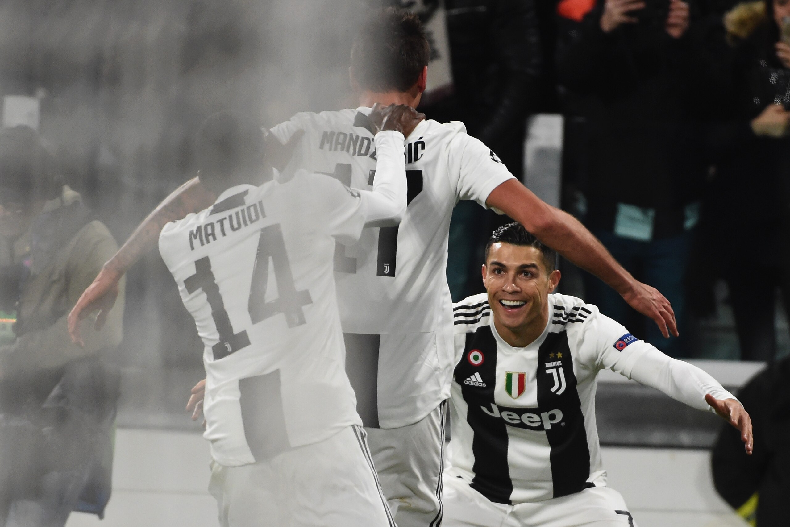 TURIN, ITALY - NOVEMBER 27:  Mario Mandzukic celebrates with Cristiano Ronaldo of Juventus during the Group H match of the UEFA Champions League between Juventus and Valencia at  on November 27, 2018 in Turin, Italy.  (Photo by Pier Marco Tacca/Getty Imag