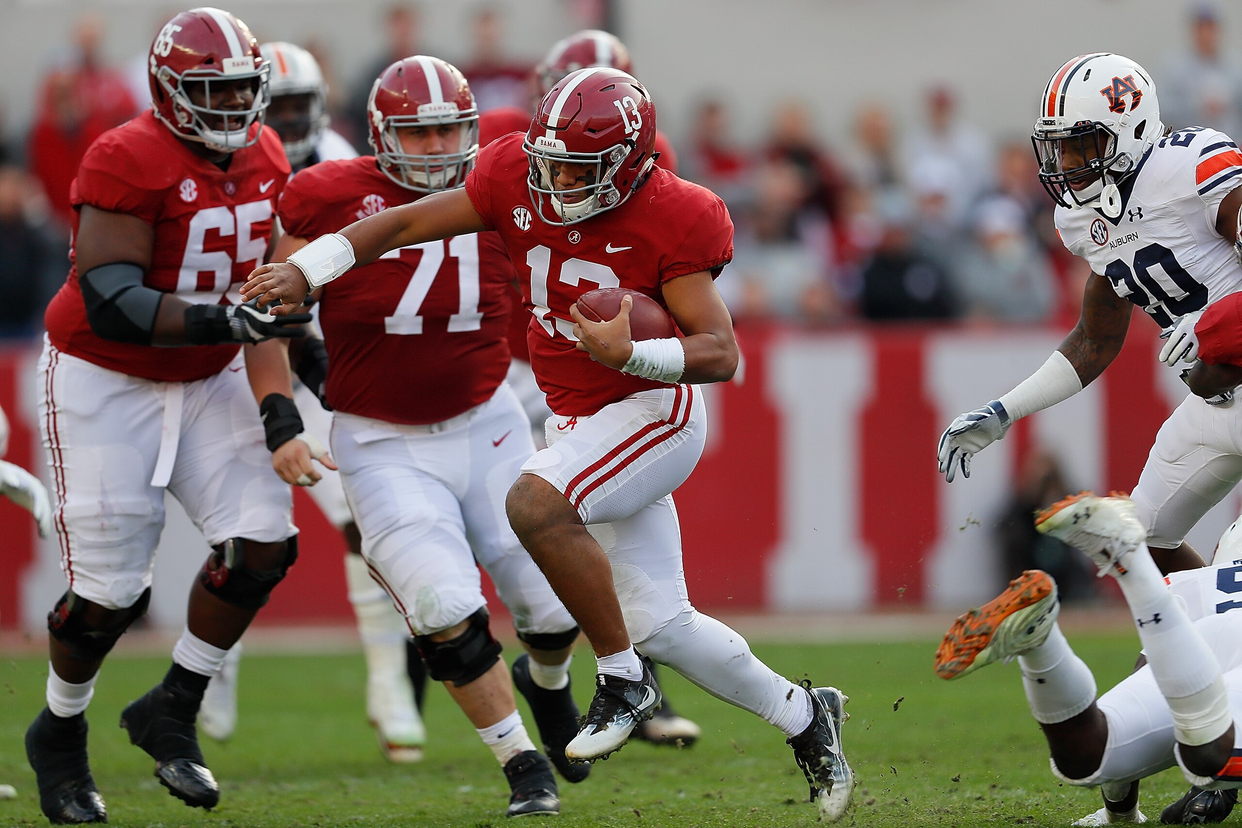 TUSCALOOSA, AL - NOVEMBER 24:  Tua Tagovailoa #13 of the Alabama Crimson Tide rushes against the Auburn Tigers at Bryant-Denny Stadium on November 24, 2018 in Tuscaloosa, Alabama.  (Photo by Kevin C. Cox/Getty Images)