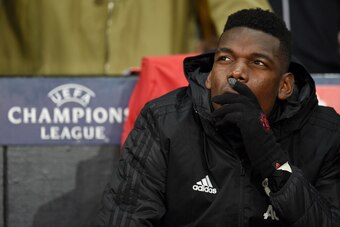 Manchester United's French midfielder Paul Pogba sits on the bench during the UEFA Champions League group H football match between Manchester United and Young Boys at Old Trafford in Manchester, north-west England on November 27, 2018. (Photo by Oli SCARF