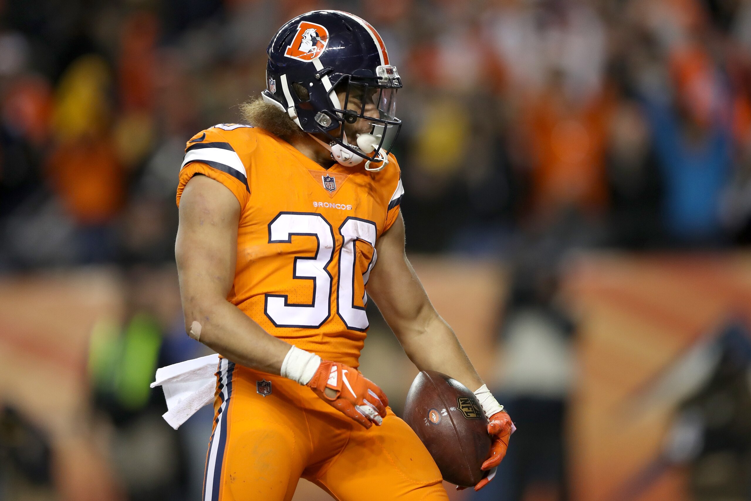 DENVER, CO - NOVEMBER 25:  Phillip Lindsay #30 of the Denver Broncos celebrates scoring a touchdown against the Pittsburgh Steelers at Broncos Stadium at Mile High  on November 25, 2018 in Denver, Colorado.  (Photo by Matthew Stockman/Getty Images)