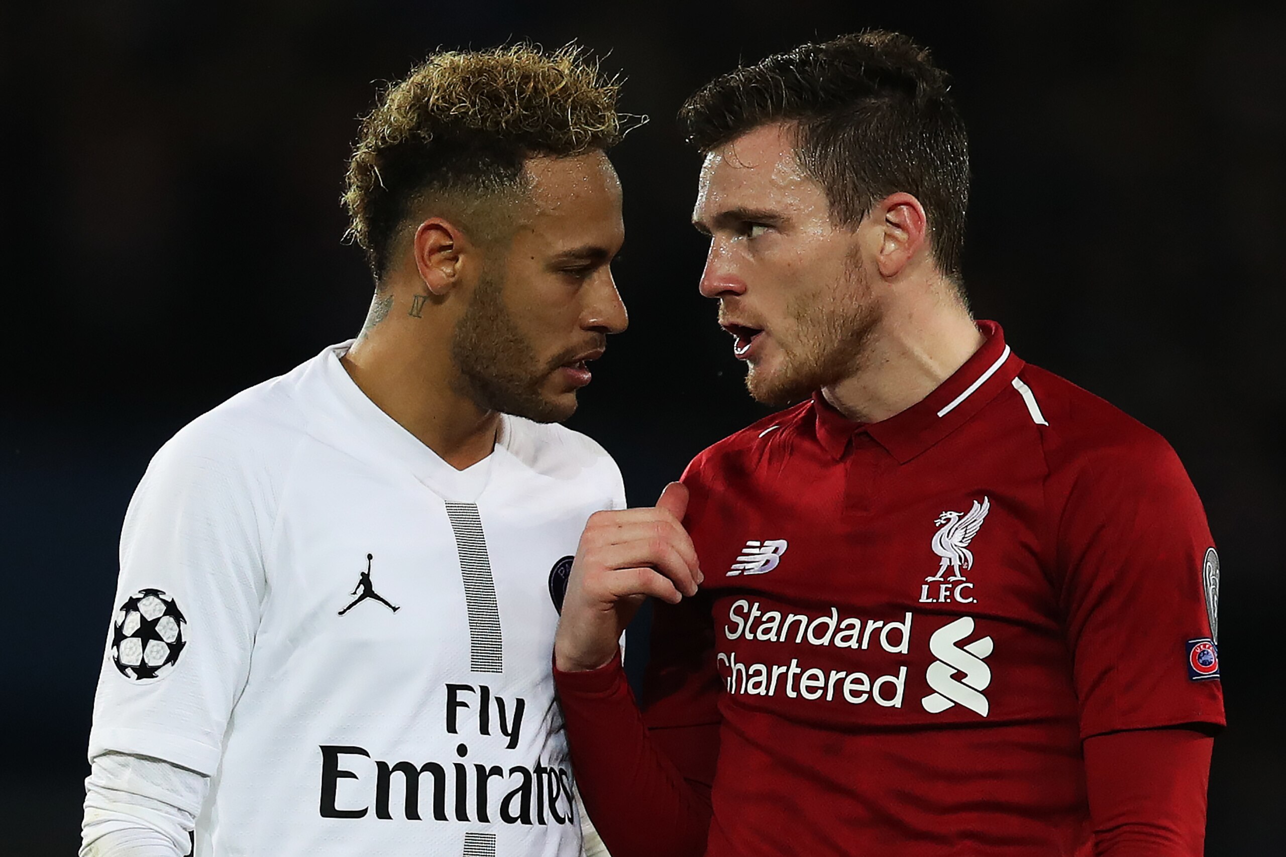 PARIS, FRANCE - NOVEMBER 28: Neymar of Paris Saint-Germain and Andrew Robertson of Liverpool disscuss a penalty award during the Group C match of the UEFA Champions League between Paris Saint-Germain and Liverpool at Parc des Princes on November 28, 2018 