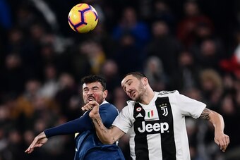 SPAL's Italian forward Andrea Petagna (L) and Juventus' Italian defender Leonardo Bonucci go for a header during the Italian Serie A football match Juventus vs Spal 2013 on November 24, 2018 at the Juventus stadium in Turin. (Photo by Marco BERTORELLO / A