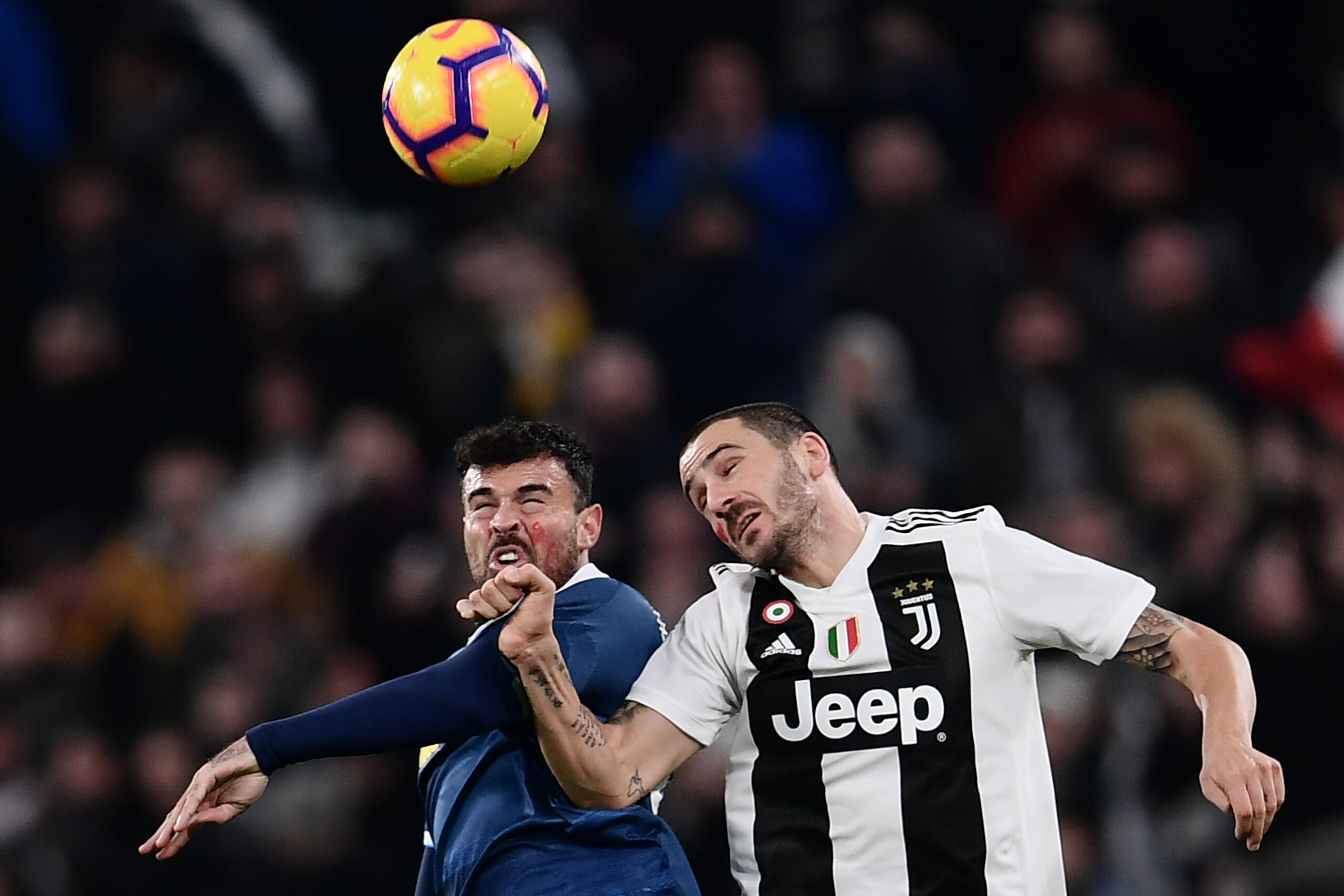 SPAL's Italian forward Andrea Petagna (L) and Juventus' Italian defender Leonardo Bonucci go for a header during the Italian Serie A football match Juventus vs Spal 2013 on November 24, 2018 at the Juventus stadium in Turin. (Photo by Marco BERTORELLO / A
