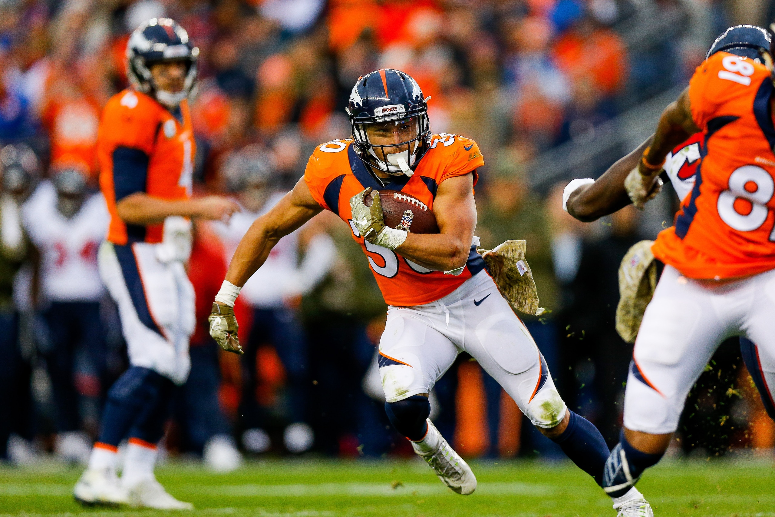 DENVER, CO - NOVEMBER 4:  Running back Phillip Lindsay #30 of the Denver Broncos rushes against the Houston Texans in the third quarter of a game at Broncos Stadium at Mile High on November 4, 2018 in Denver, Colorado. (Photo by Justin Edmonds/Getty Image