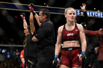 EDMONTON, AB - SEPTEMBER 09:  Amanda Nunes, left, reacts after defeating Valentina Shevchenko, right, during UFC 215 at Rogers Place on September 9, 2017 in Edmonton, Canada. (Photo by Codie McLachlan/Getty Images)
