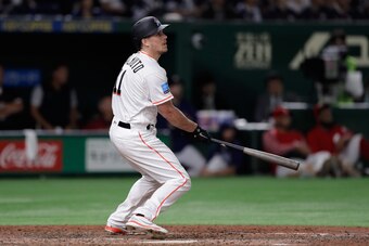 TOKYO, JAPAN - NOVEMBER 10:  Catcher J.T. Realmuto #11 of the Miami Marlins hits a three-run home run in the bottom of 8th inning during the game two of the Japan and MLB All Stars at Tokyo Dome on November 10, 2018 in Tokyo, Japan.  (Photo by Kiyoshi Ota