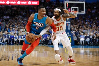 Russell Westbrook driving on DeAndre' Bembry.