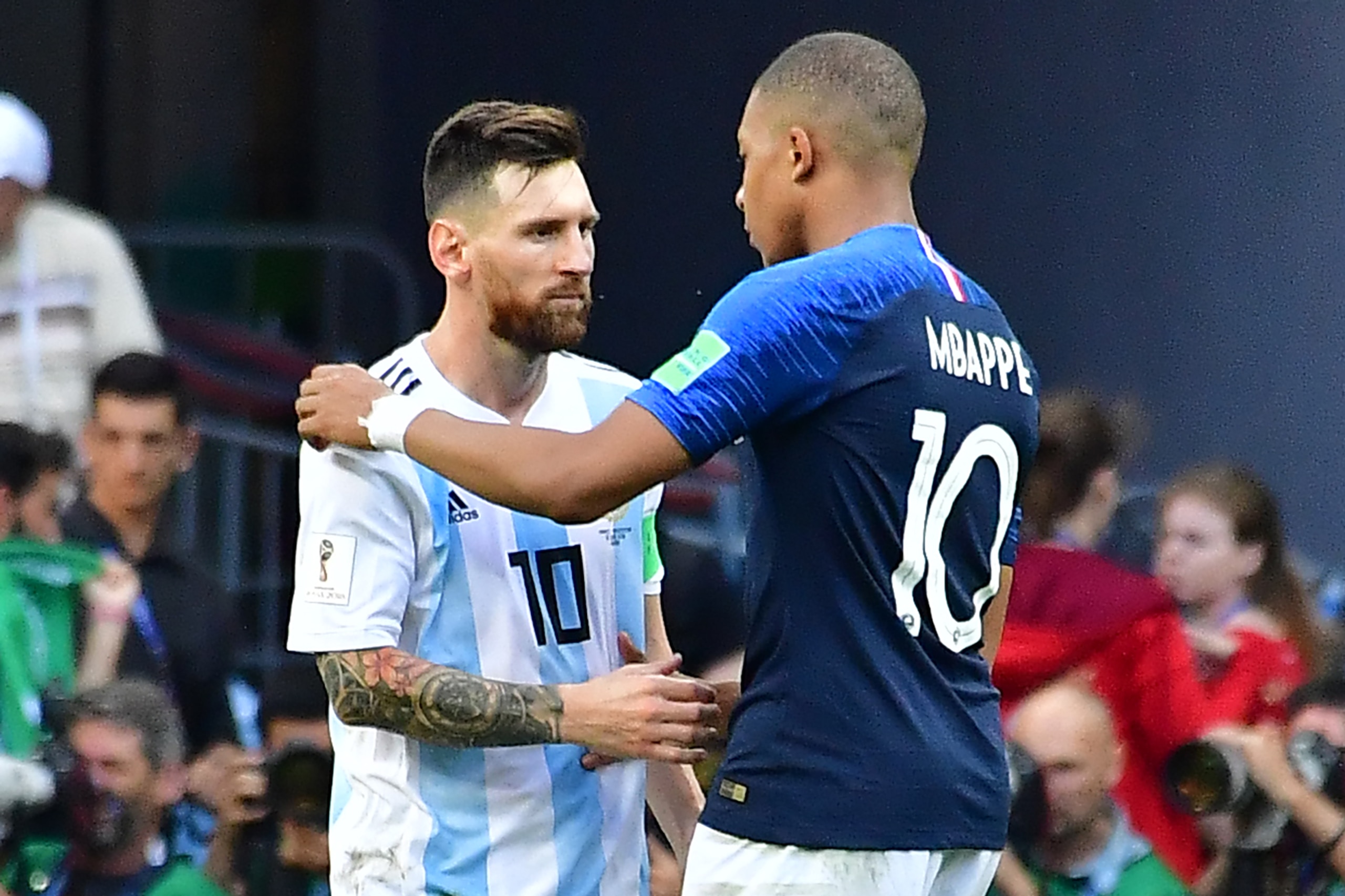Argentina's forward Lionel Messi congratulates France's forward Kylian Mbappe (R) at the end of the Russia 2018 World Cup round of 16 football match between France and Argentina at the Kazan Arena in Kazan on June 30, 2018. (Photo by Luis Acosta / AFP) / 