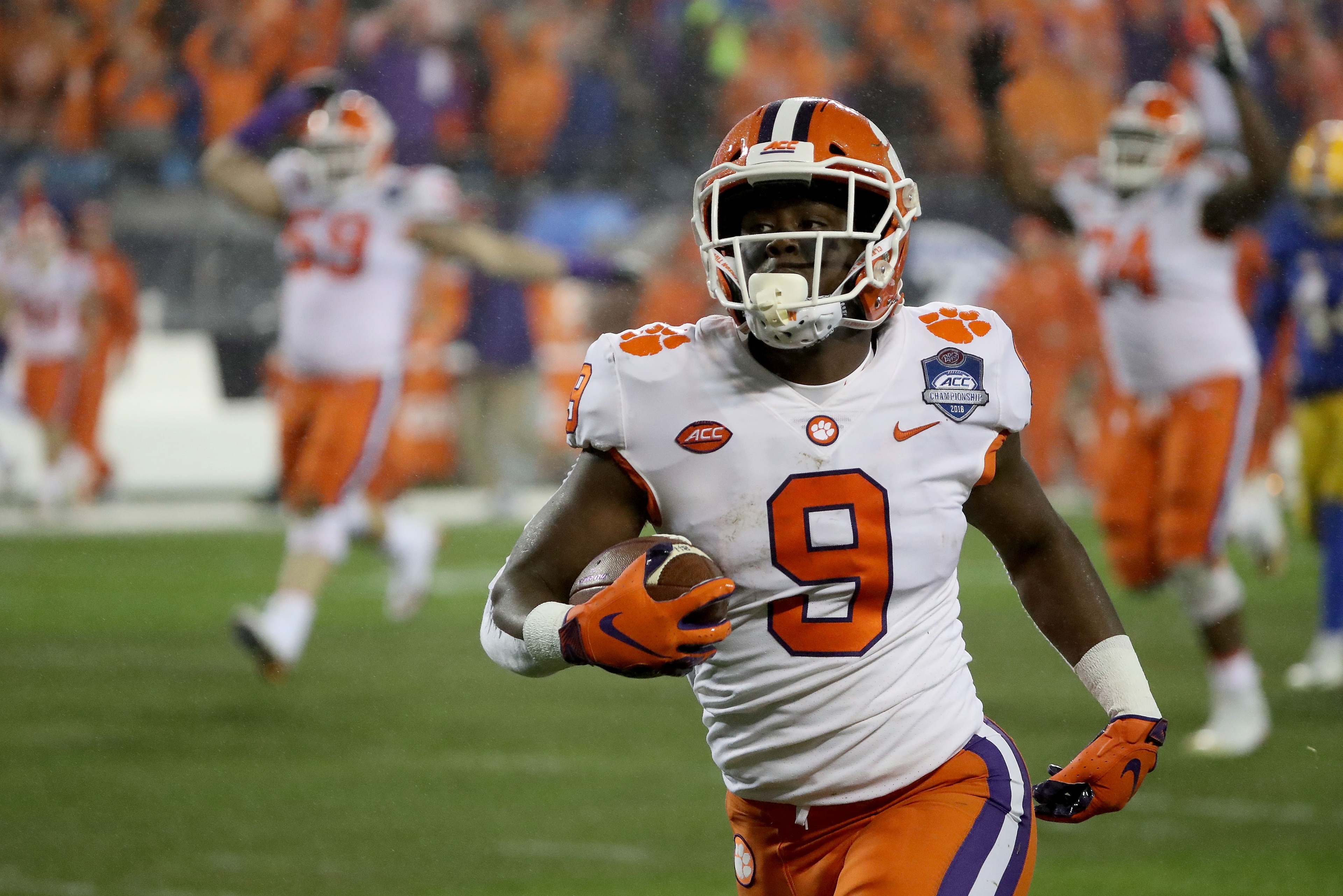 CHARLOTTE, NC - DECEMBER 01:  Travis Etienne #9 of the Clemson Tigers runs for a touchdown against the Pittsburgh Panthers in the first quarter at Bank of America Stadium on December 1, 2018 in Charlotte, North Carolina.  (Photo by Streeter Lecka/Getty Im