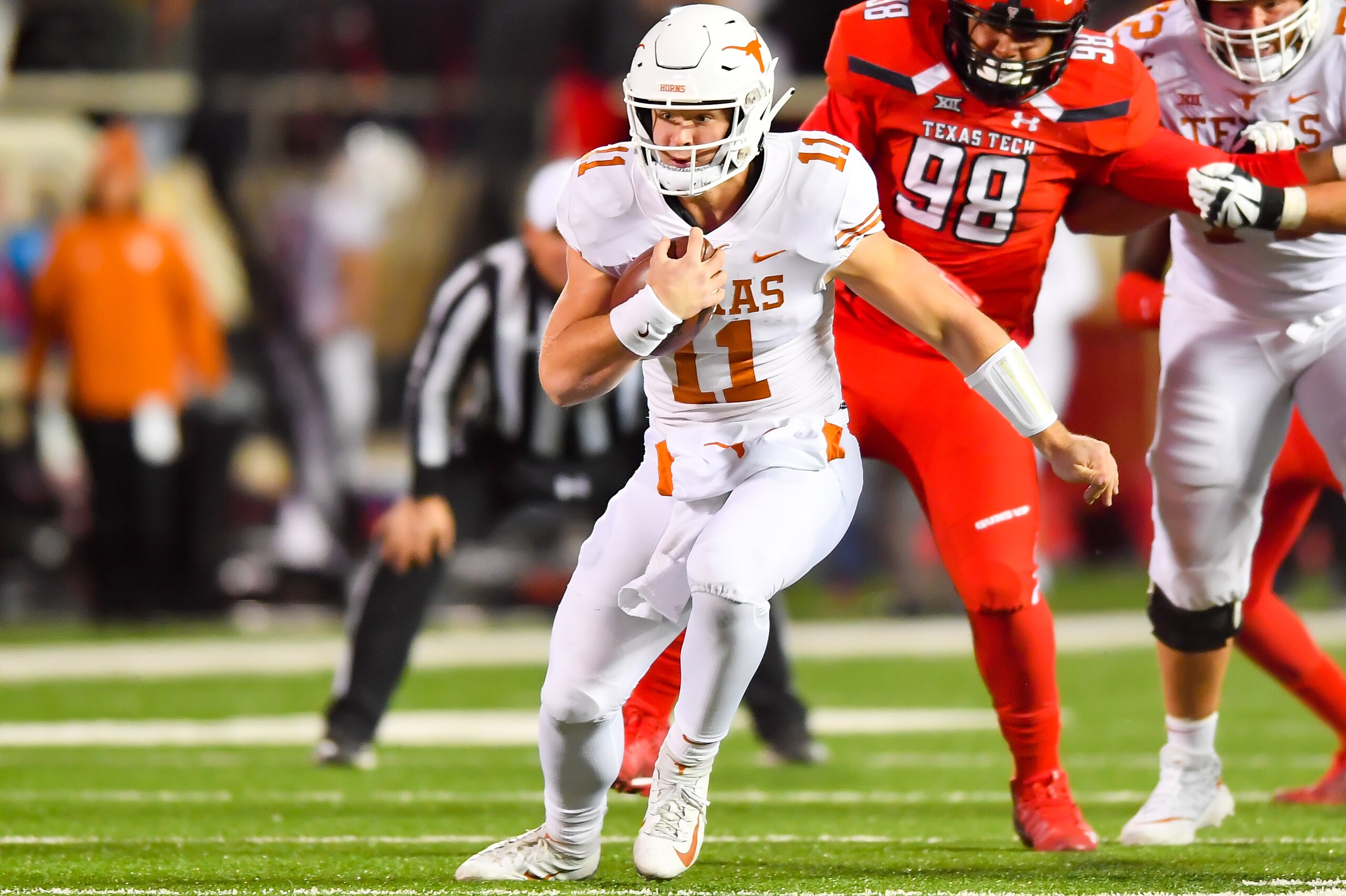 LUBBOCK, TX - NOVEMBER 10: Sam Ehlinger #11 of the Texas Longhorns runs with the ball during the game against the Texas Tech Red Raiders on November 10, 2018 at Jones AT&T Stadium in Lubbock, Texas. Texas defeated Texas Tech 41-34. (Photo by John Weast/Ge