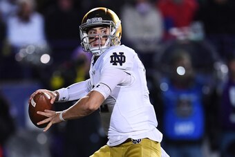 EVANSTON, IL - NOVEMBER 03:  Ian Book #12 of the Notre Dame Fighting Irish looks to pass during the second half of a game against the Northwestern Wildcats at Ryan Field on November 3, 2018 in Evanston, Illinois.  (Photo by Stacy Revere/Getty Images)