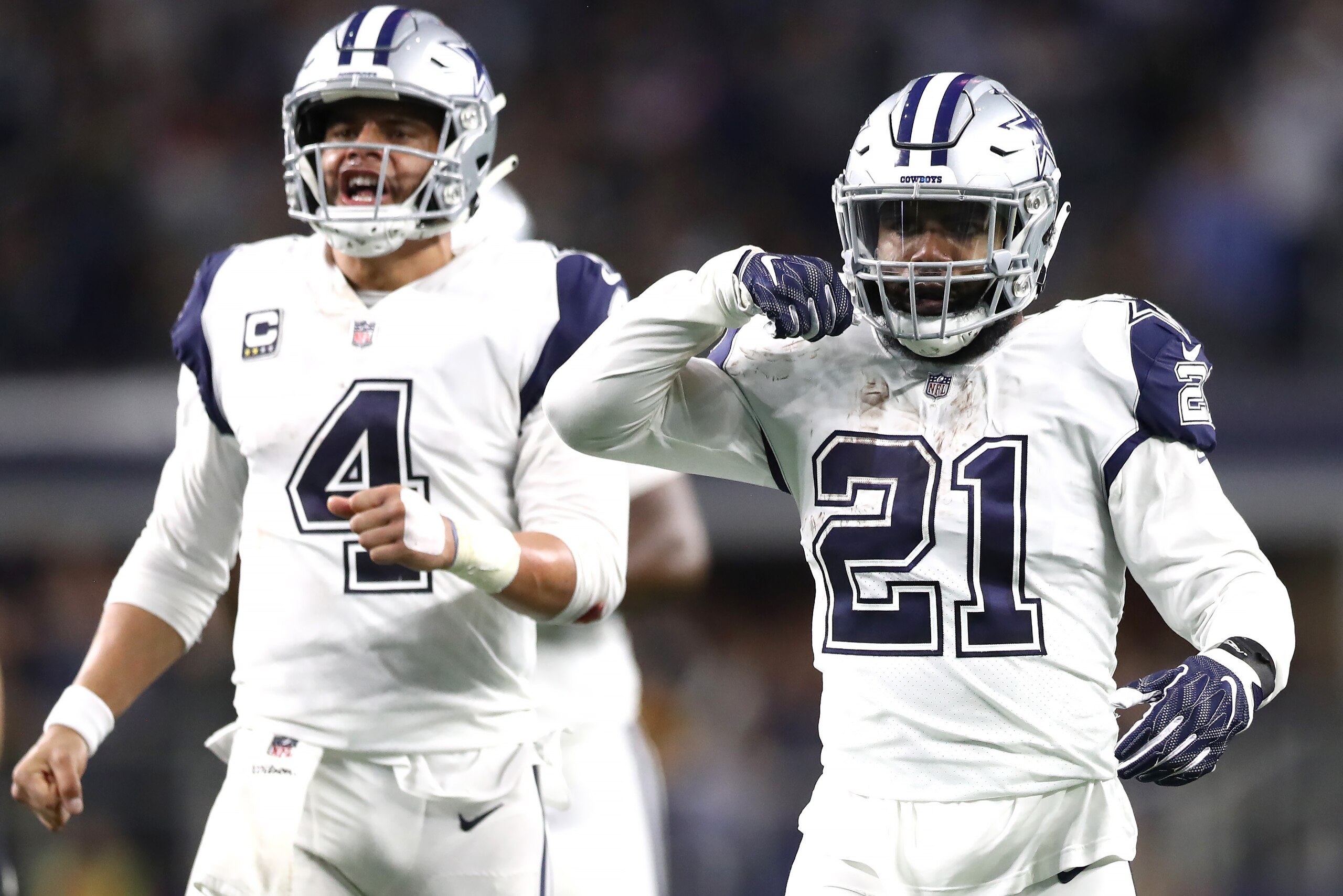ARLINGTON, TEXAS - NOVEMBER 29:  Ezekiel Elliott #21 of the Dallas Cowboys reacts after running for a first down with Dak Prescott #4 in the fourth quarter against the New Orleans Saints at AT&T Stadium on November 29, 2018 in Arlington, Texas. (Photo by 