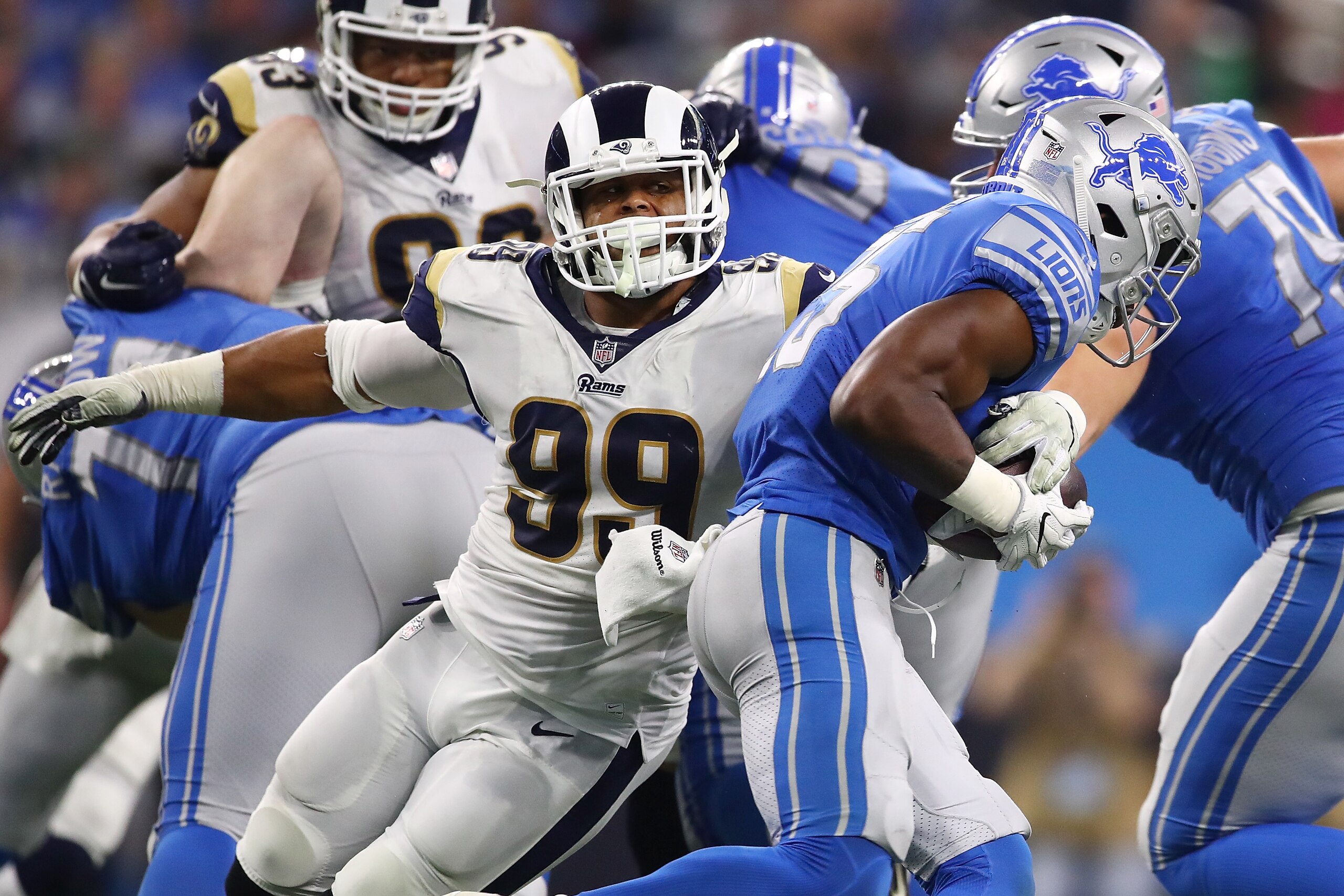 DETROIT, MI - DECEMBER 02: Aaron Donald #99 of the Los Angeles Rams tackles running back Theo Riddick #25 of the Detroit Lions during the first half at Ford Field on December 2, 2018 in Detroit, Michigan. (Photo by Gregory Shamus/Getty Images) DETROIT, MI - DECEMBER 02: Aaron Donald #99 of the Los Angeles Rams tackles running back Theo Riddick #25 of the Detroit Lions during the first half at Ford Field on December 2, 2018 in Detroit, Michigan. (Photo by Gregory Shamus/Getty Images)