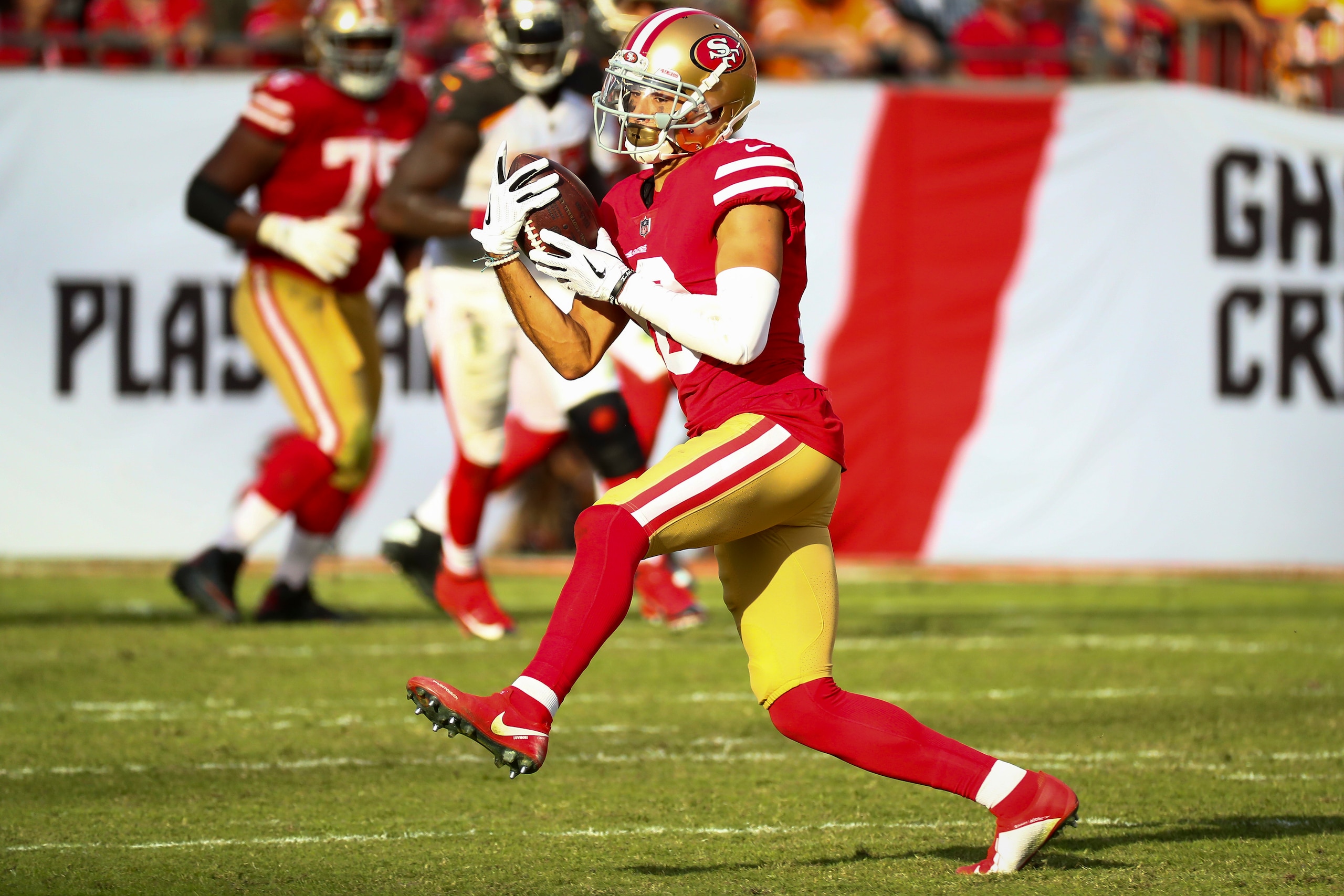 TAMPA, FL - NOVEMBER 25: Wide receiver Dante Pettis #18 of the San Francisco 49ers makes a catch for a gain of 22 yards and a first down in the fourth quarter of the game at Raymond James Stadium on November 25, 2018 in Tampa, Florida. The Tampa Bay Bucca
