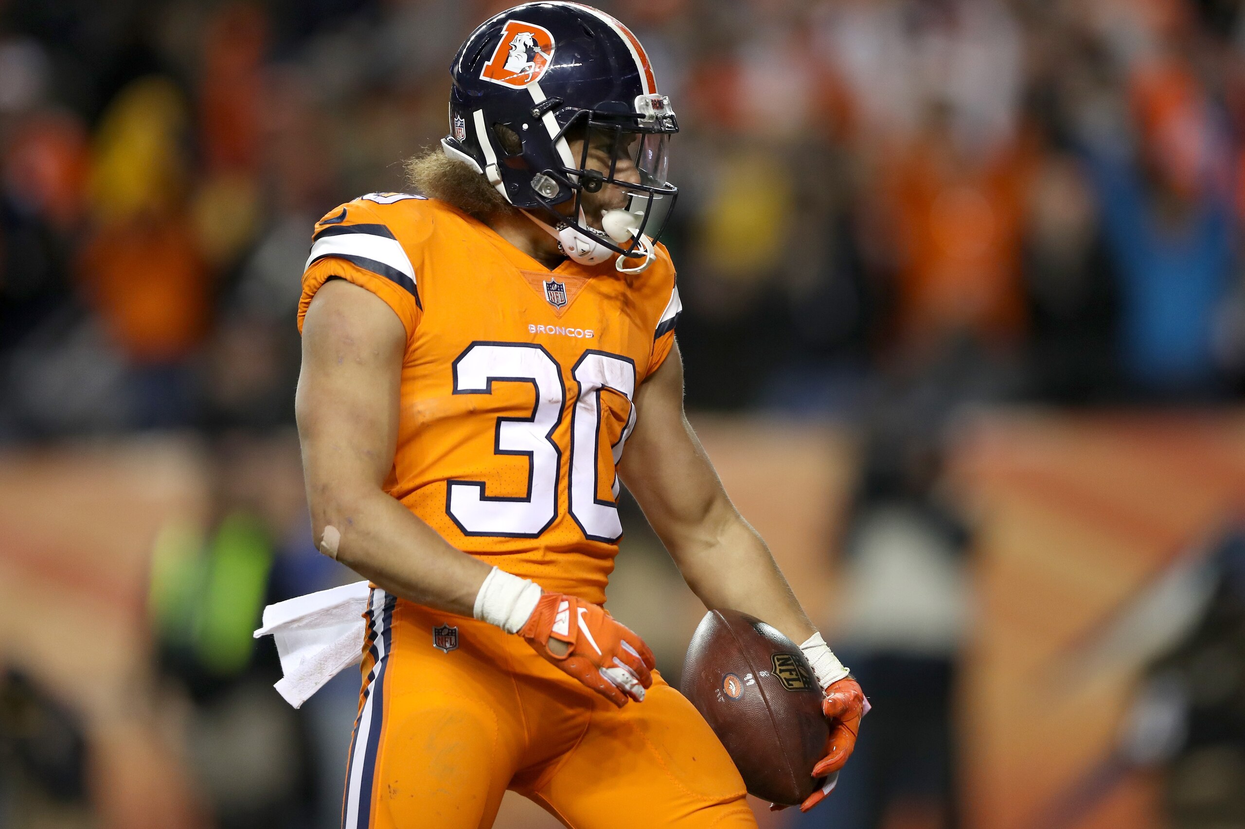 DENVER, CO - NOVEMBER 25:  Phillip Lindsay #30 of the Denver Broncos celebrates scoring a touchdown against the Pittsburgh Steelers at Broncos Stadium at Mile High  on November 25, 2018 in Denver, Colorado.  (Photo by Matthew Stockman/Getty Images)