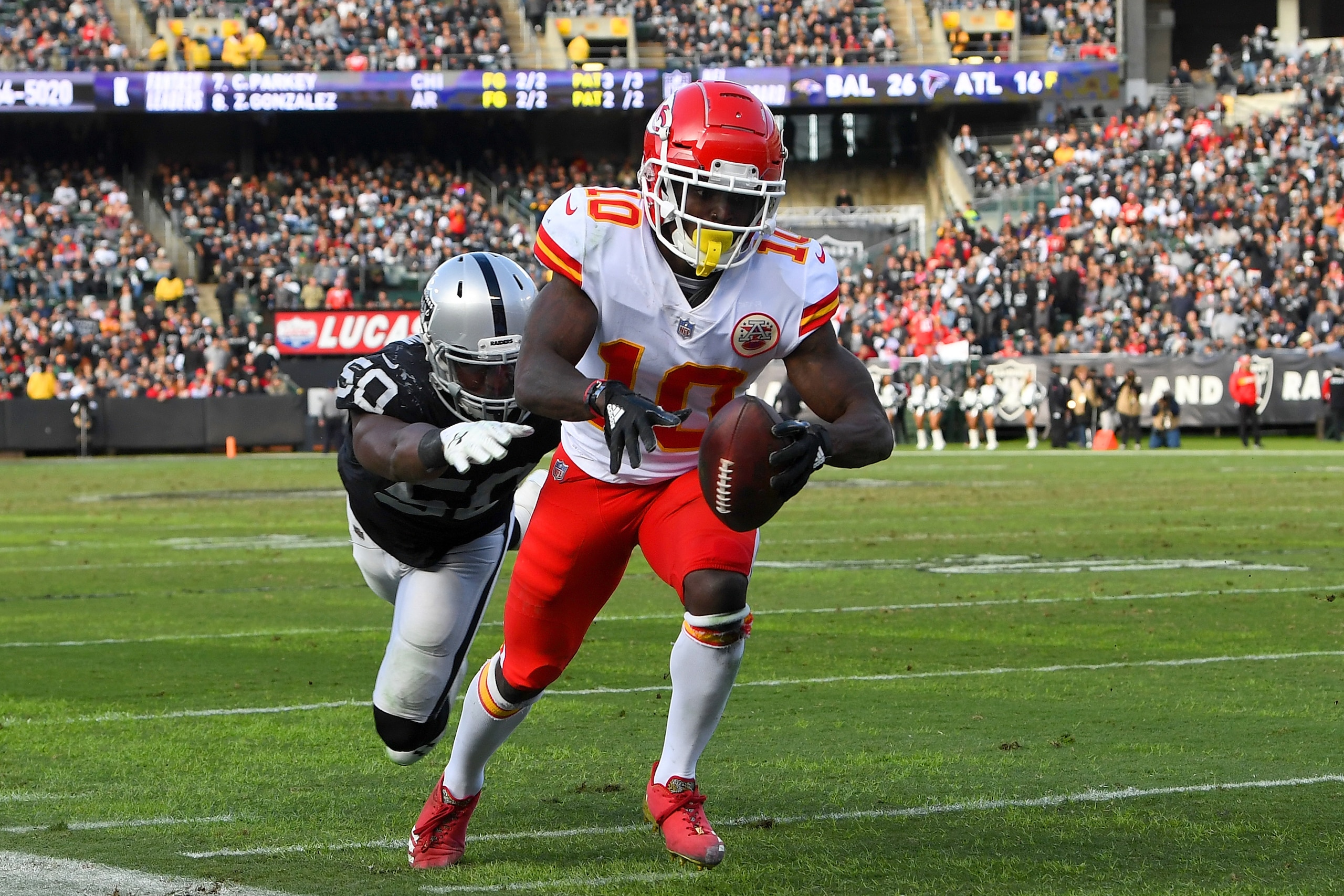 OAKLAND, CA - DECEMBER 02:  Tyreek Hill #10 of the Kansas City Chiefs steps out of bounds diving short of the end zone against the Oakland Raiders during the second half of their NFL game at Oakland-Alameda County Coliseum on December 2, 2018 in Oakland, 