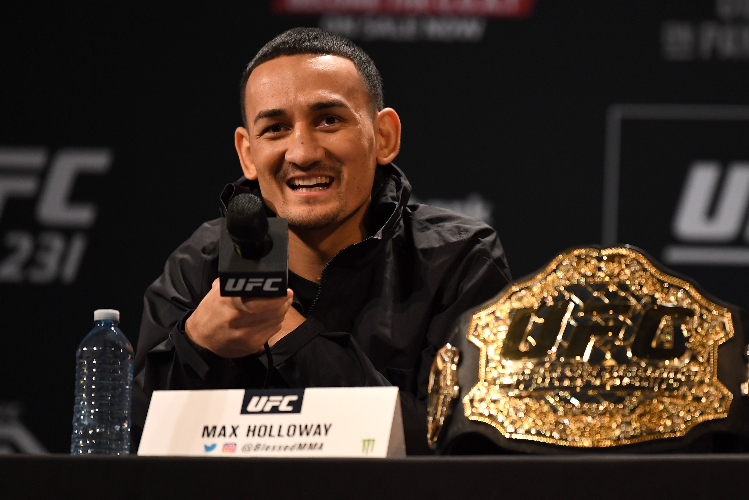 TORONTO, CANADA - DECEMBER 05:  UFC featherweight champion Max Holloway interacts with fans and media during the UFC 231 Press Conference at the Winter Garden Theatre on December 5, 2018 in Toronto, Ontario, Canada. (Photo by Josh Hedges/Zuffa LLC/Zuffa L