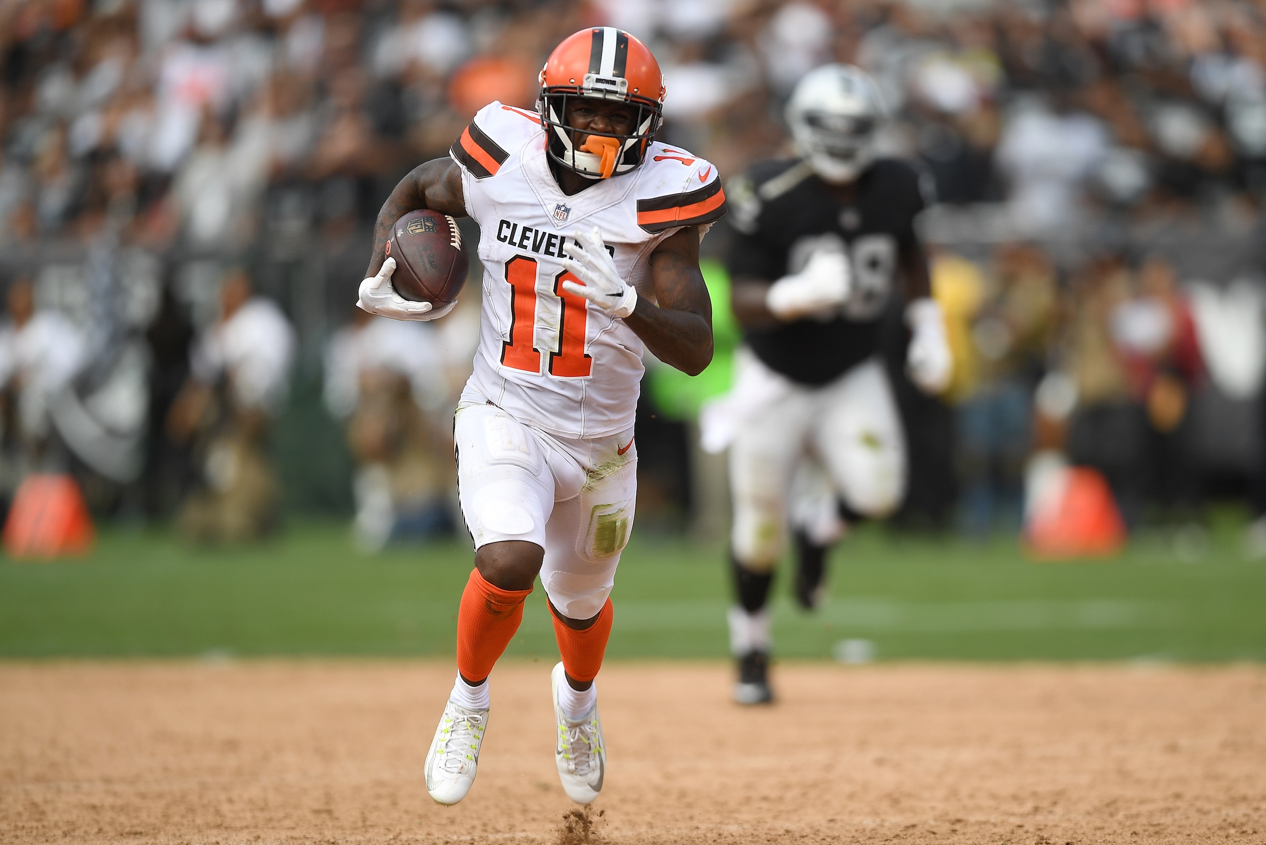 OAKLAND, CA - SEPTEMBER 30:  Antonio Callaway #11 of the Cleveland Browns runs with the ball up the field on a 59 yard pass play against the Oakland Raiders during the fourth quarter of their NFL football game at Oakland-Alameda County Coliseum on Septemb