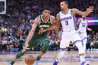 SACRAMENTO, CA - NOVEMBER 28:  Giannis Antetokounmpo #34 of the Milwaukee Bucks drives to the basket on George Hill #3 of the Sacramento Kings during their NBA basketball game at Golden 1 Center on November 28, 2017 in Sacramento, California. NOTE TO USER