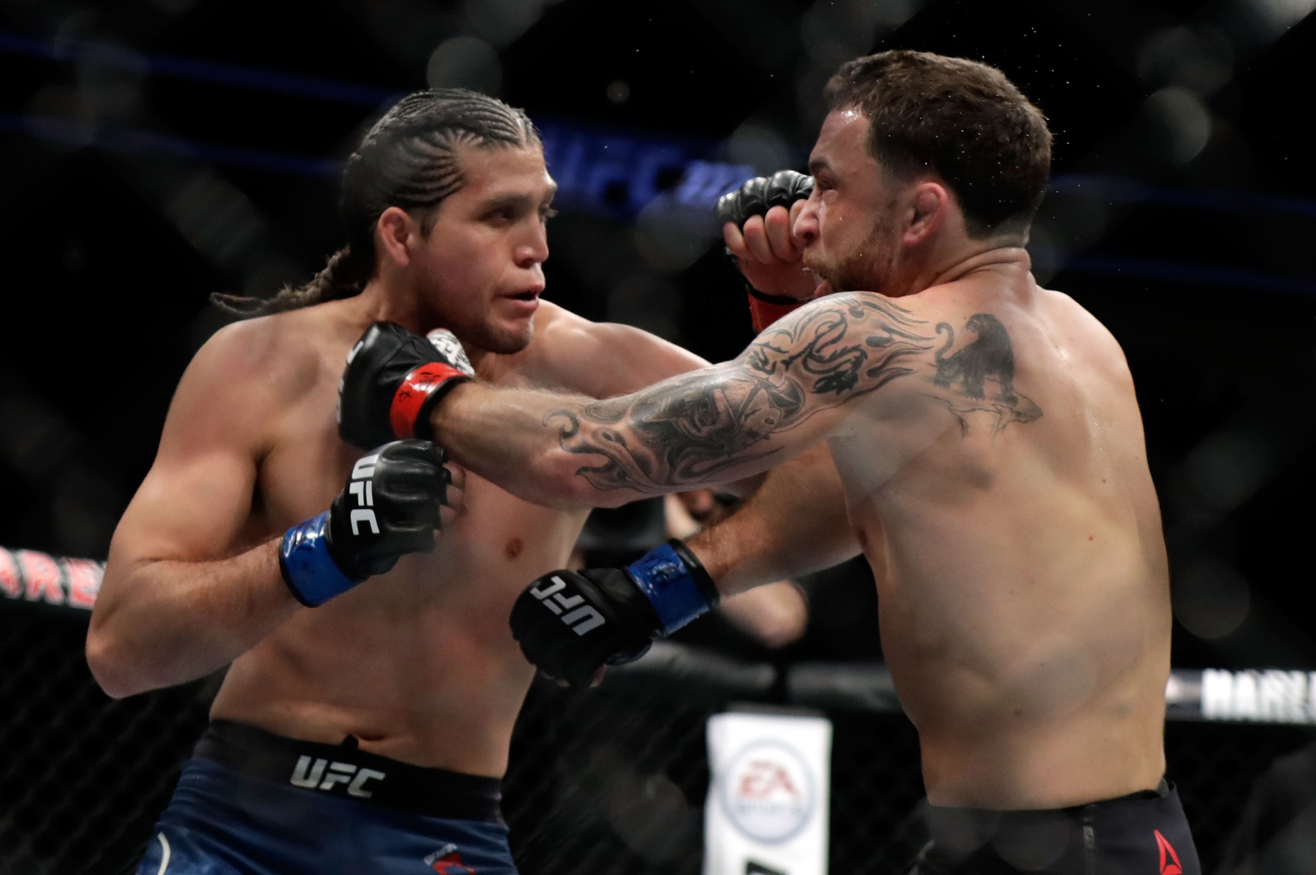 LAS VEGAS, NV - MARCH 03:  Frankie Edgar (R) and Brian Ortega fight during their featherweight bout during UFC 222 at T-Mobile Arena on March 3, 2018 in Las Vegas, Nevada. Ortega won by TKO.  (Photo by Isaac Brekken/Getty Images)