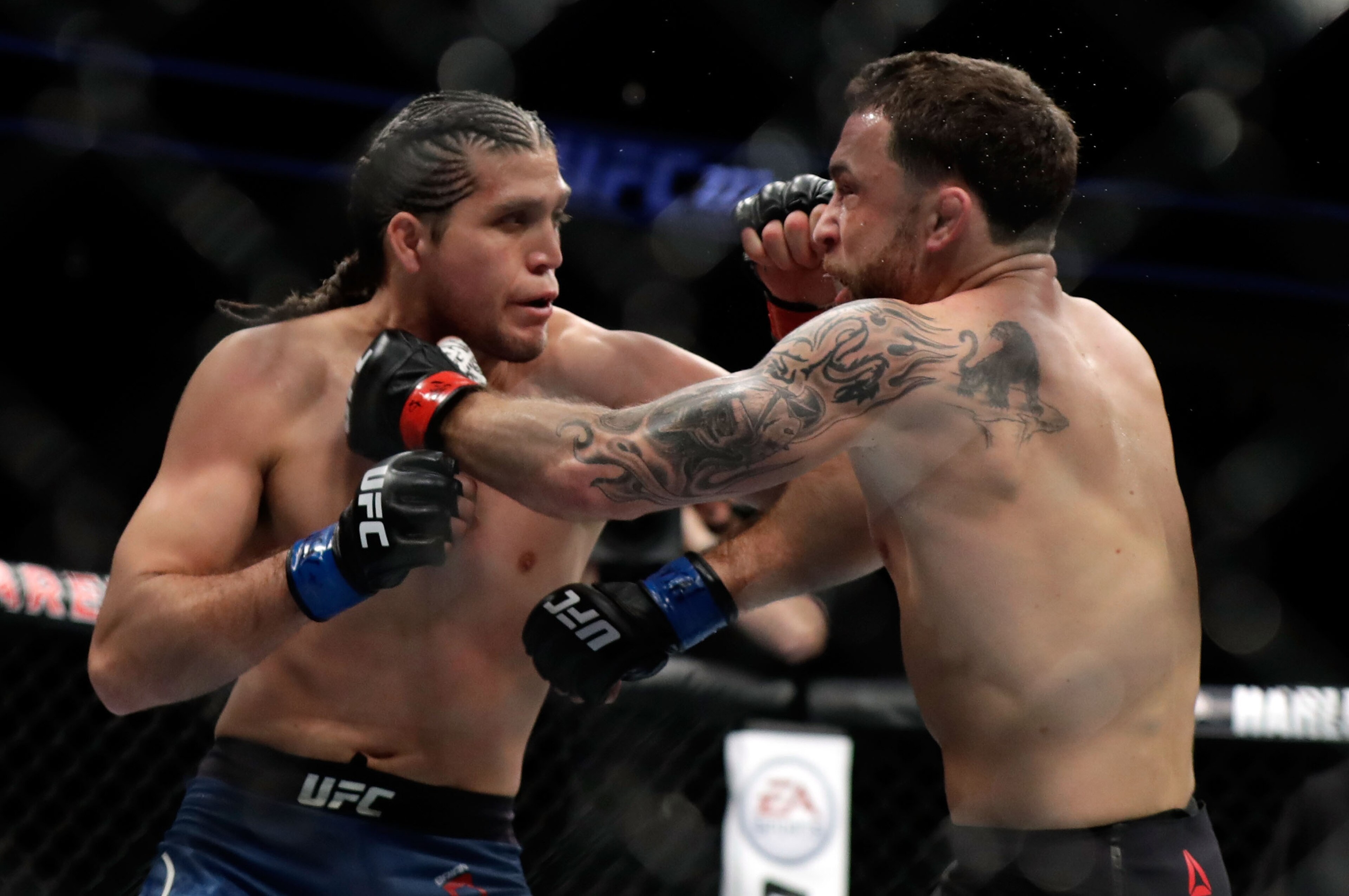 LAS VEGAS, NV - MARCH 03:  Frankie Edgar (R) and Brian Ortega fight during their featherweight bout during UFC 222 at T-Mobile Arena on March 3, 2018 in Las Vegas, Nevada. Ortega won by TKO.  (Photo by Isaac Brekken/Getty Images)